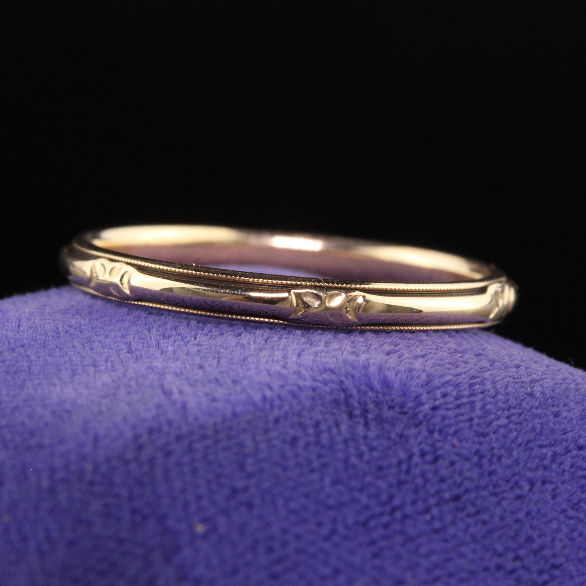 Beautiful Antique Art Deco Wood and Sons 14K Yellow Gold Engraved Wedding Band. This classic Art Deco wedding band is crafted in 14K yellow gold and has beautiful engravings around the entire band.

Item #R1134

Metal: 14K Yellow Gold

Weight: 1.9