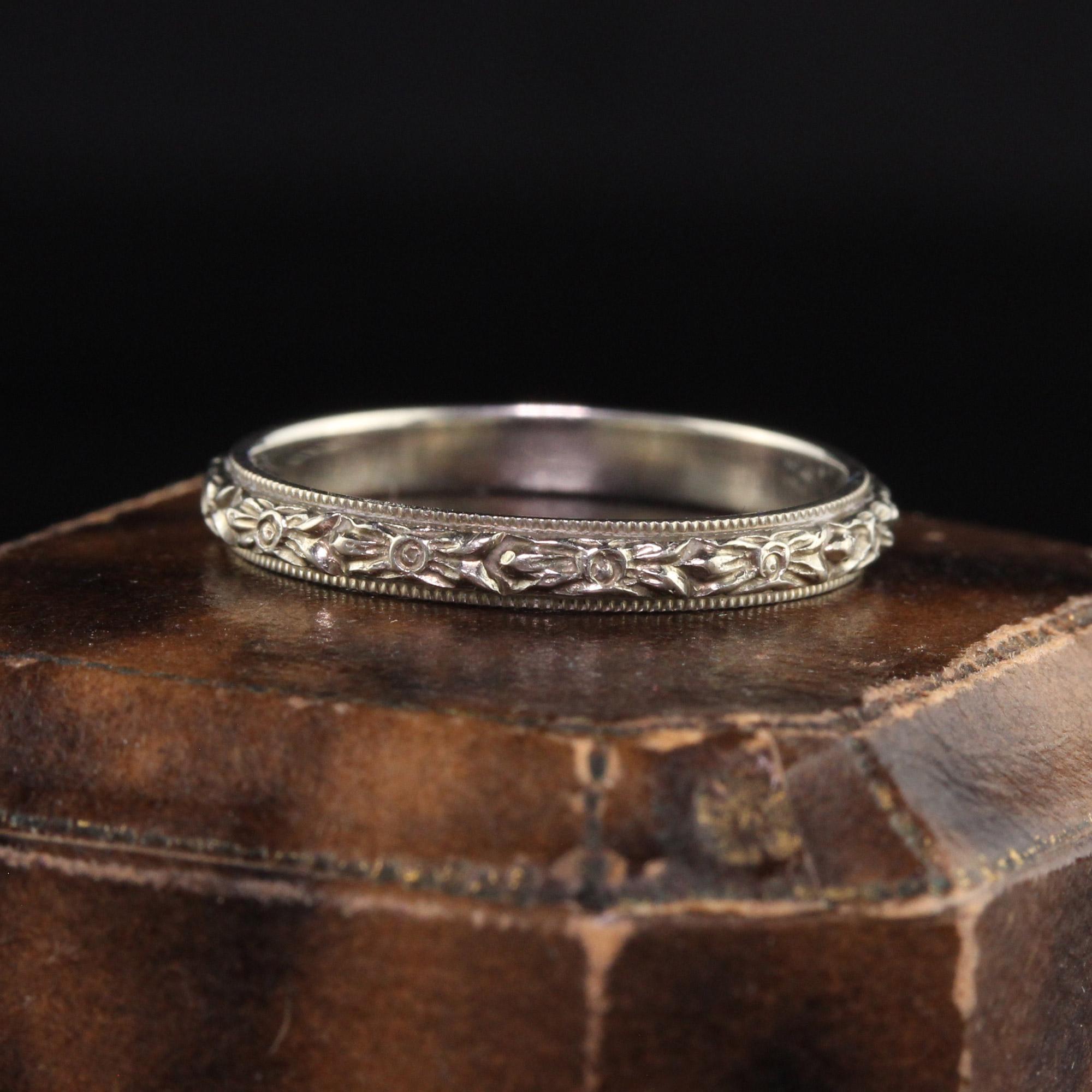 Beautiful Antique Art Deco Wood and Sons 18K White Gold Engraved Blossom Wedding Band. This incredible wedding band is in absolutely amazing condition with deep engravings going around the entire ring in a blossom pattern.

Item #R1138

Metal: 18K