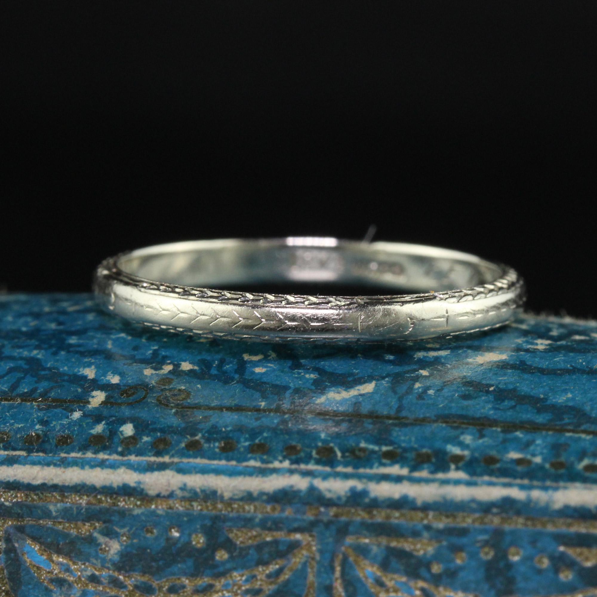 Beautiful Antique Art Deco Wood and Sons 18K White Gold Engraved Wedding Band - Size 8. This beautiful wedding band is crafted in 18k white gold. The ring has faint engravings on the top of the ring and clear engravings on both sides of the ring.
