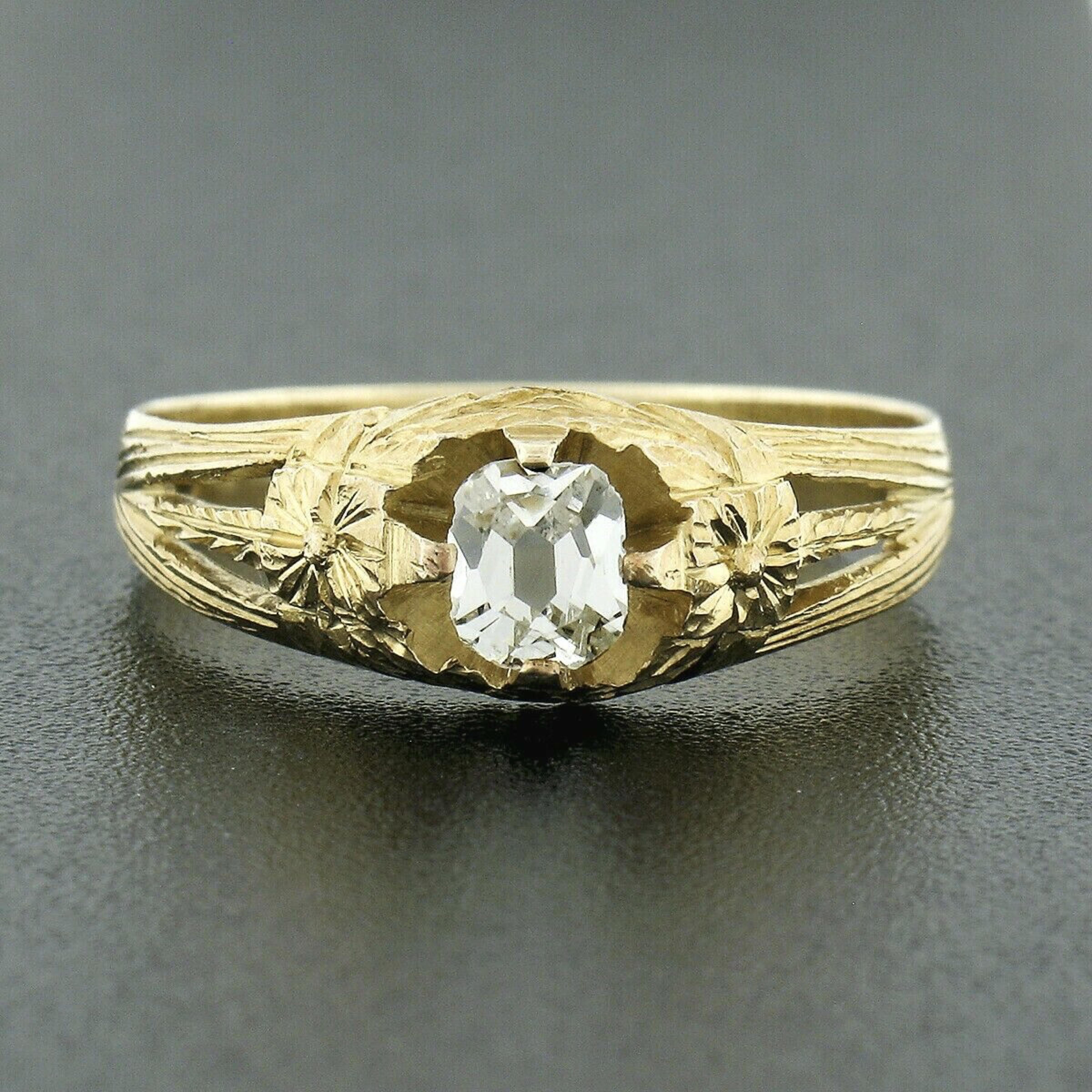 Here we have a rare and absolutely incredible antique engagement ring that was crafted during the art nouveau period from solid 14k yellow gold. It features a fine diamond with a unique old mine cut diamond neatly prong set at the open center,