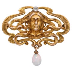 Antiguo broche Art Nouveau de oro amarillo de 14k con diamantes y ópalo Musa femenina