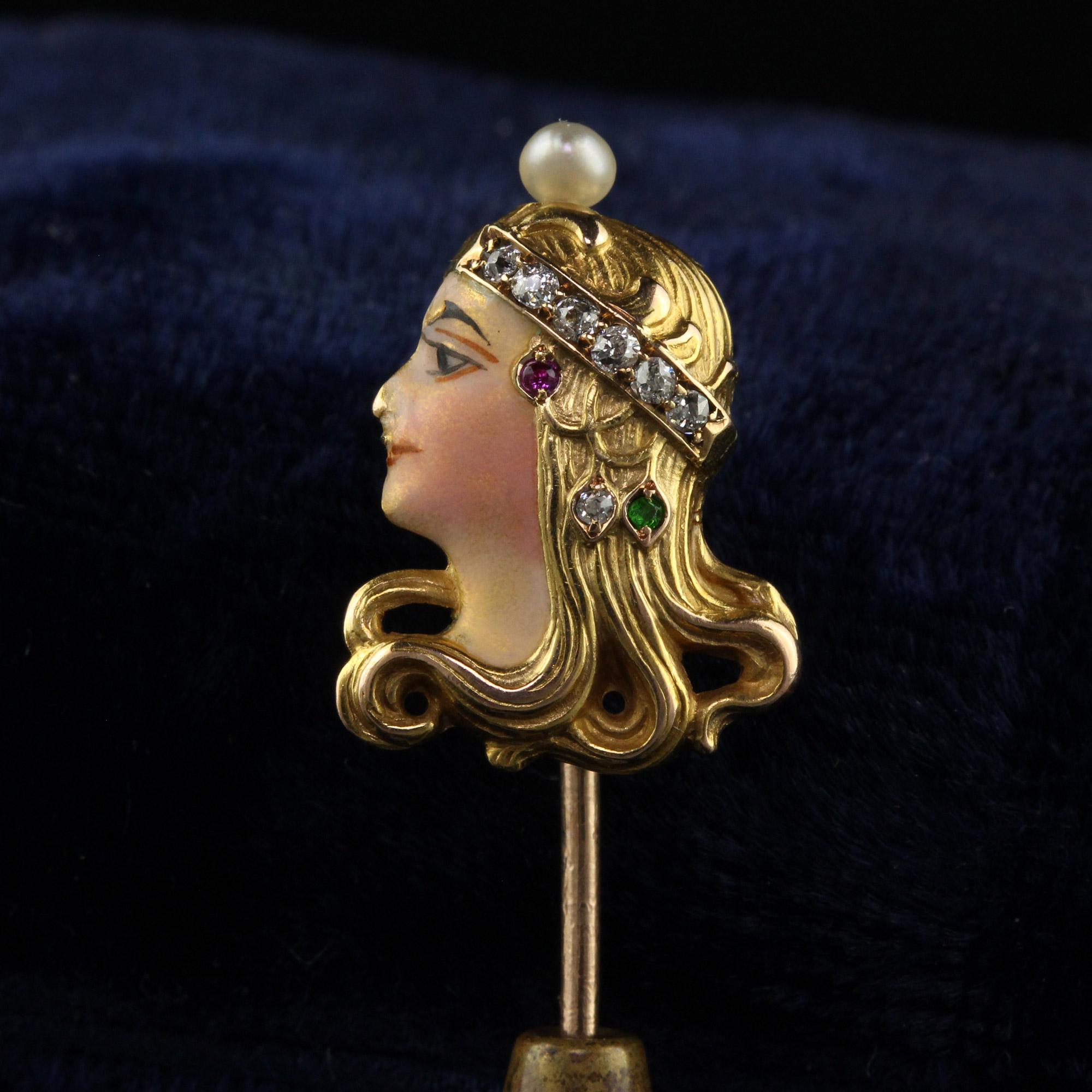 Beautiful Antique Art Nouveau 14K Yellow Gold Enamel Diamond Lady Stick Pin. This gorgeous Art Nouveau stick pin is crafted in 14k yellow gold. The pin features a lady that has an enamel face with makeup on it. Her headband is made of a row of old