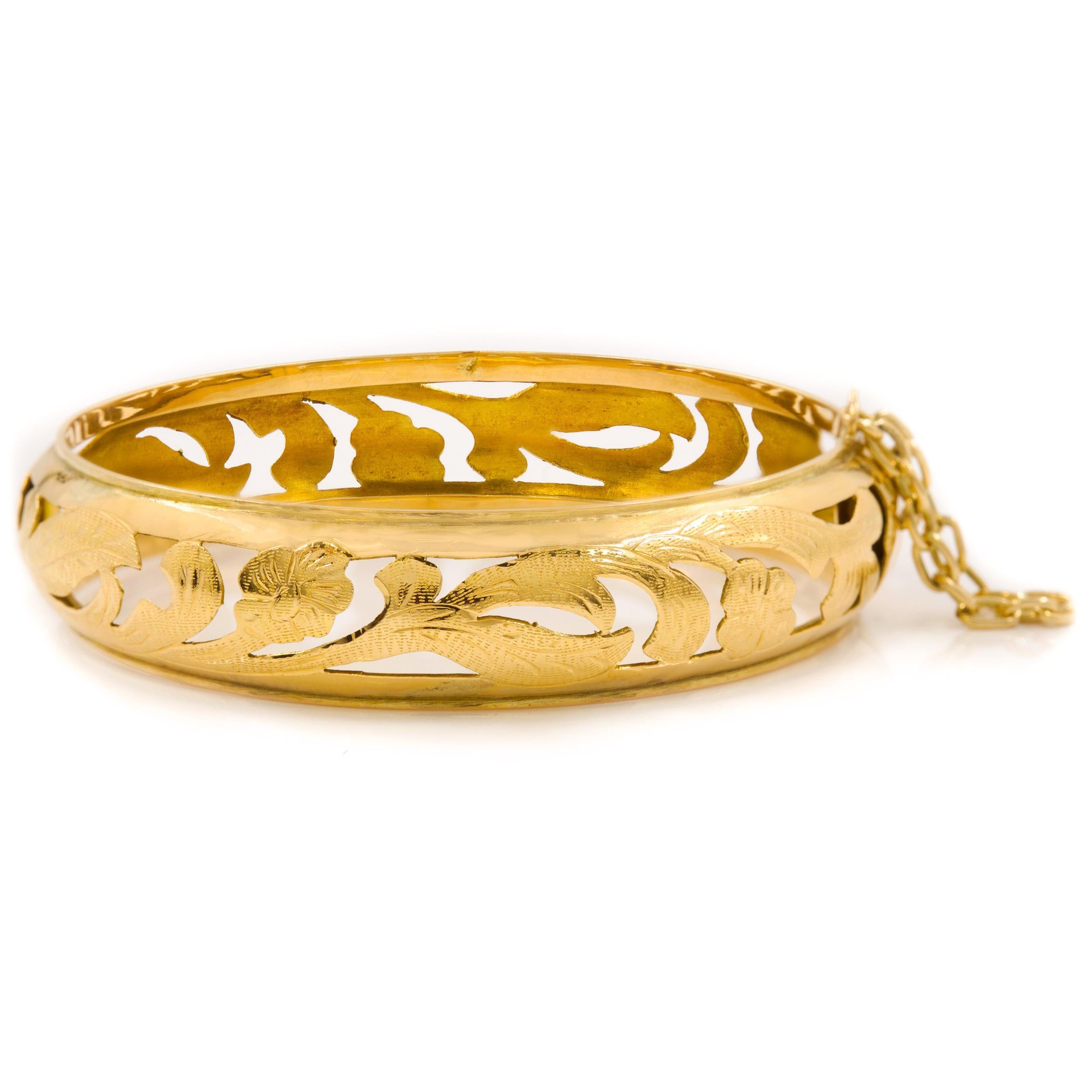 ANTIQUE ART NOUVEAU 14K GOLD BANGLE BRACELET
With a pierced and engraved floral design; circa early 20th century
Item # C104205 

A fine quality antique Art Nouveau bangle bracelet crafted entirely of 14k gold that has been beautifully pierced to