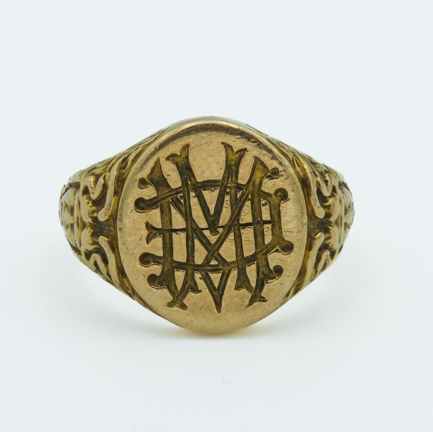 This Art Nouveau era yellow gold ring, dated inside 1900, is a fine example of the period's aesthetic, which often included fluid, organic forms and mythological motifs. The band features a figural depiction of Medusa, a nod to the era's fascination