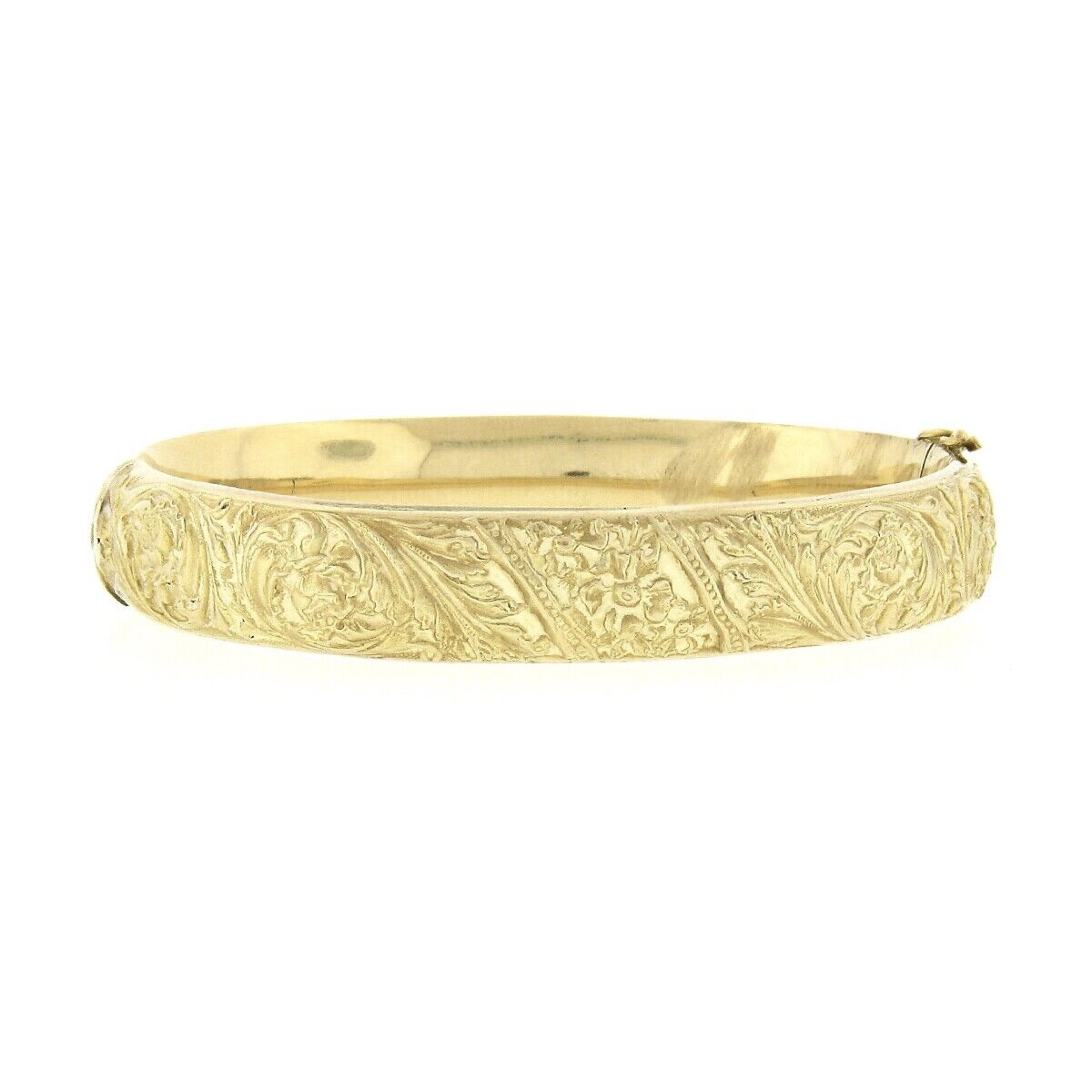 Here we have an elegant antique bangle bracelet was crafted during the art nouveau period in solid 18k yellow gold. It features absolutely gorgeous floral repousse work throughout the entire bracelet. This lovely engraved work gives this piece a