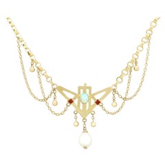 Collier ancien Art nouveau des années 1900 en or jaune, opale et rubis