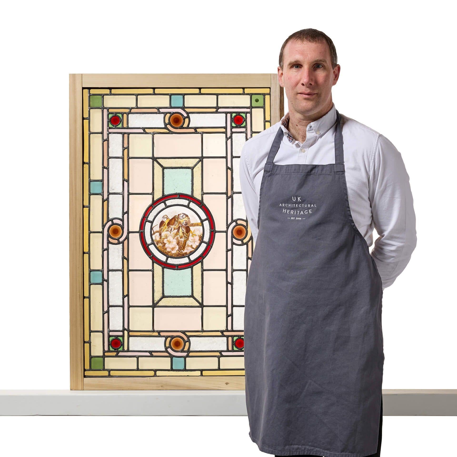 An antique Art Nouveau style stained glass window dating to circa 1890.
 
This panel showcases a hand painted design of organic patterns with a stylised geometric flair and a striking scene of blue tits to the centre, evoking serenity and meticulous