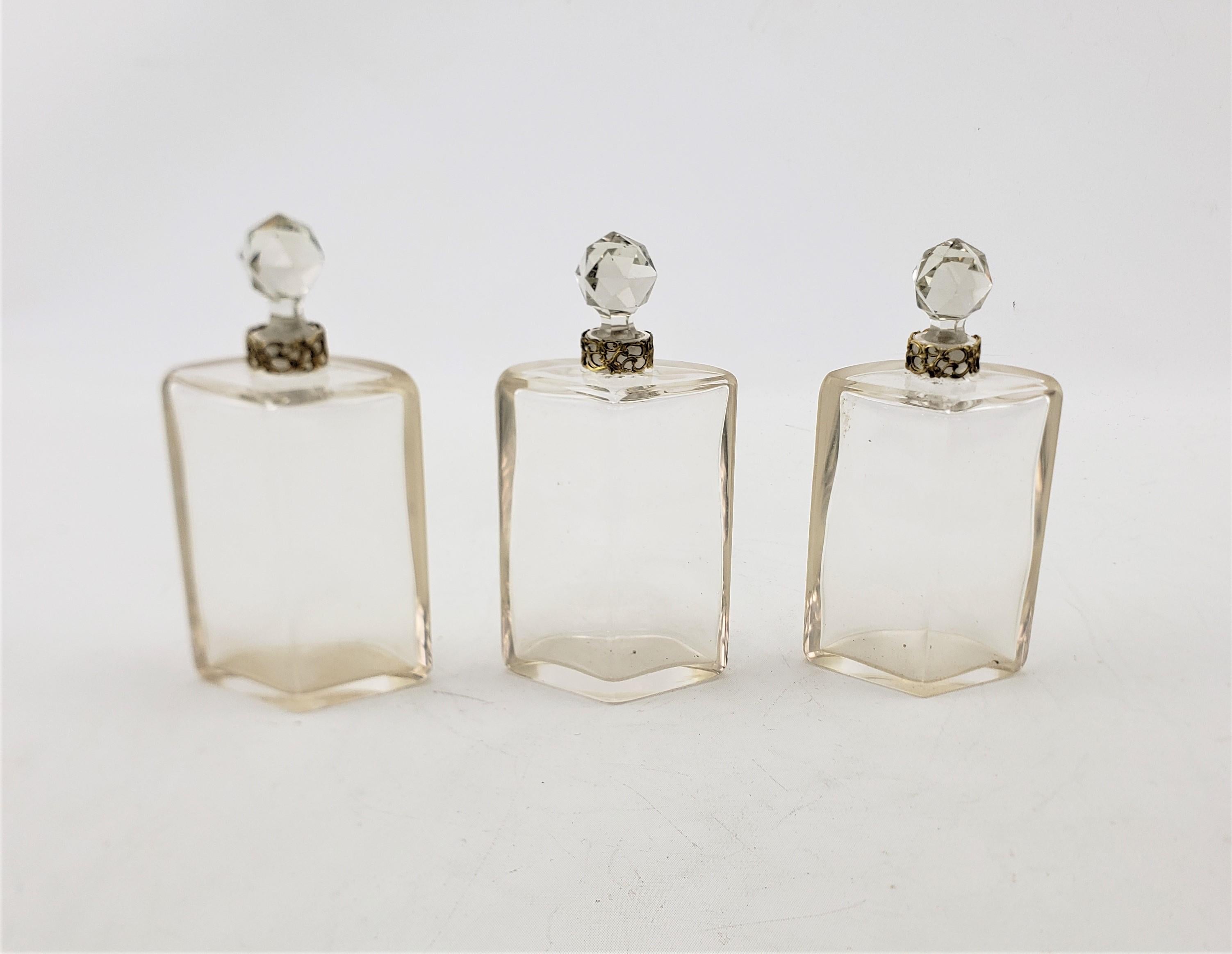 Bronze Antique Art Nouveau 3 Glass Perfume Bottle Set with Stylized Nude Female Motif For Sale