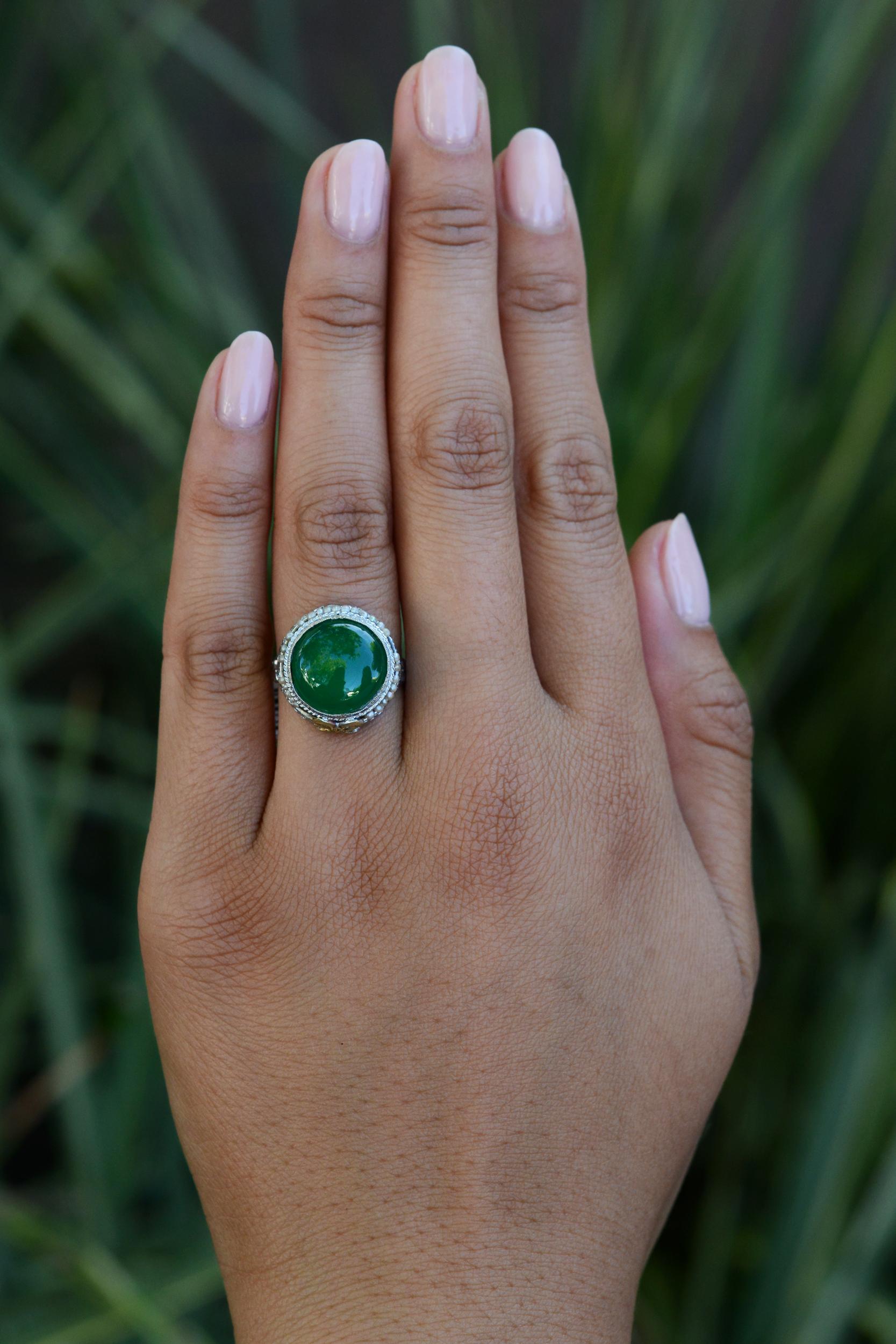 This authentic antique cocktail ring hails from the early 1900s Art Nouveau period. The captivating Chrysoprase gemstone weighs an impressive 4 carats, and due to its phenomenal color it does not utilize backing or glue. Expertly crafted with 14