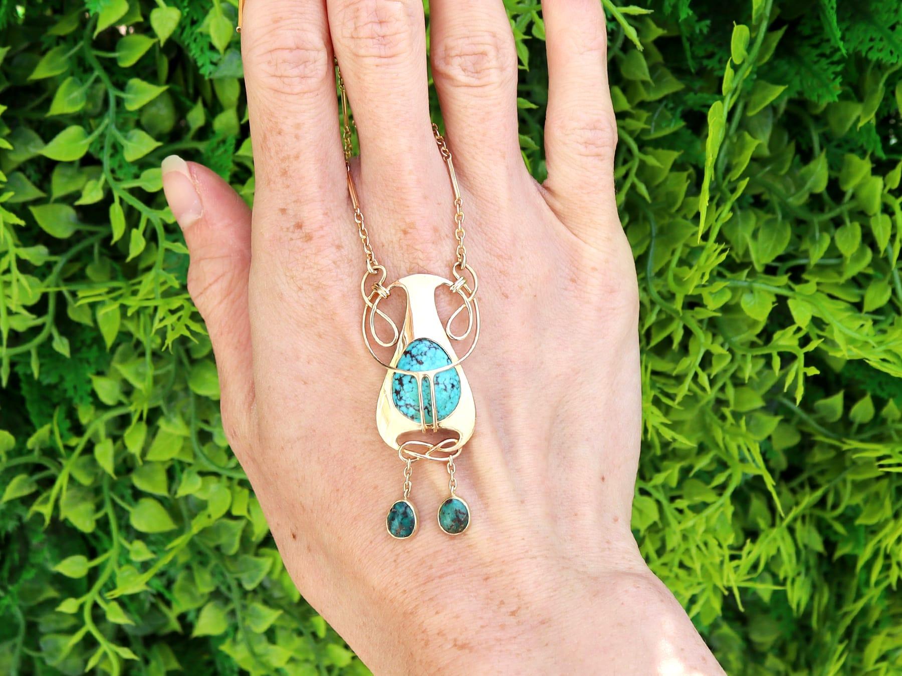 An exceptional, fine and impressive antique Art Nouveau 4.76 carat turquoise and 15 karat yellow gold pendant; part of our diverse antique jewelry and estate jewelry collections.

This fine and impressive antique pendant has been crafted in 15k