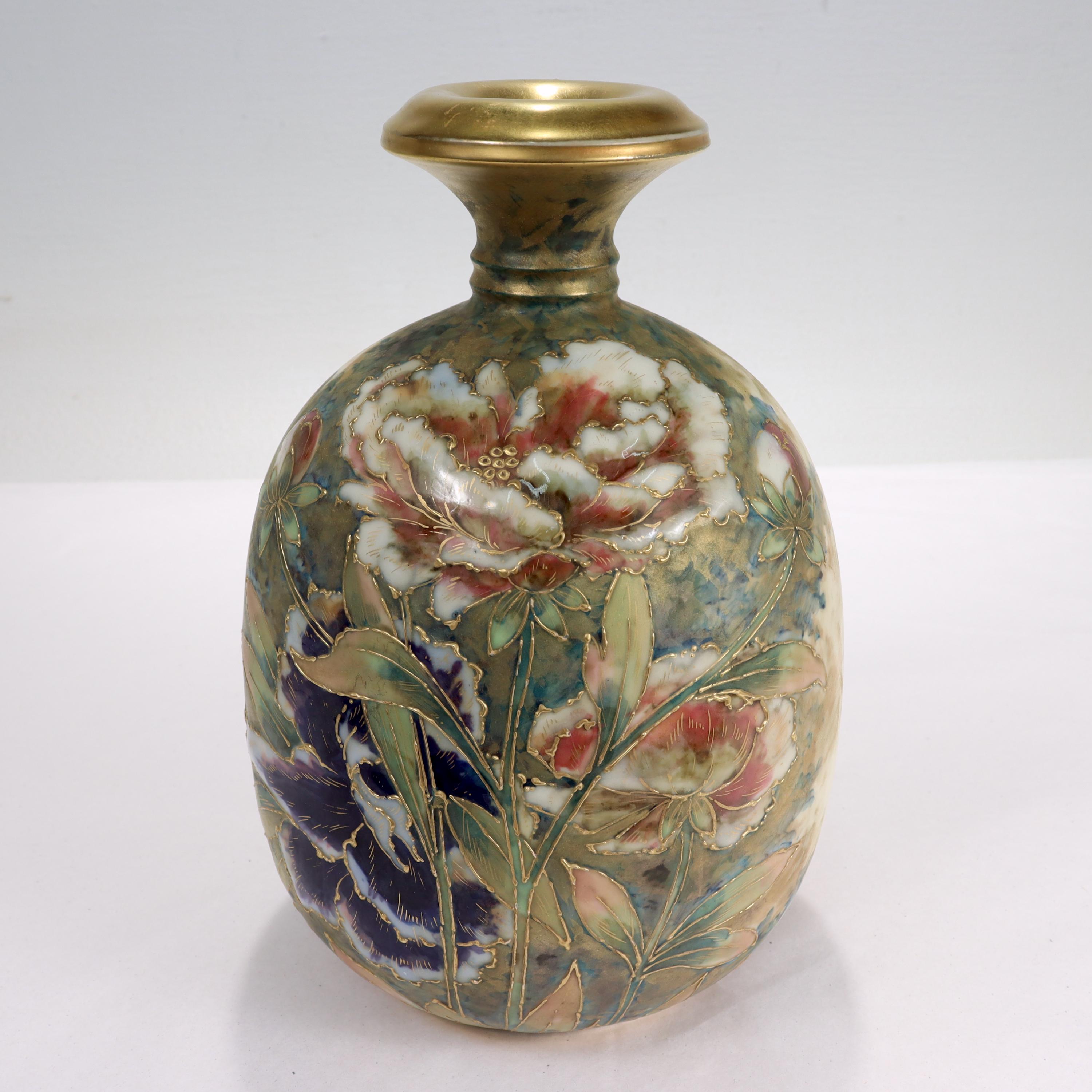 A fine antique Art Nouveau amphora vase.

With matte & enamel peony flowers painted over a matte forest scene ground. 

Form no. 523.

From the Turn-Teplitz region.

Simply a lovely vase from Amphora!

Date:
Late 19th or Early 20th Century

Overall