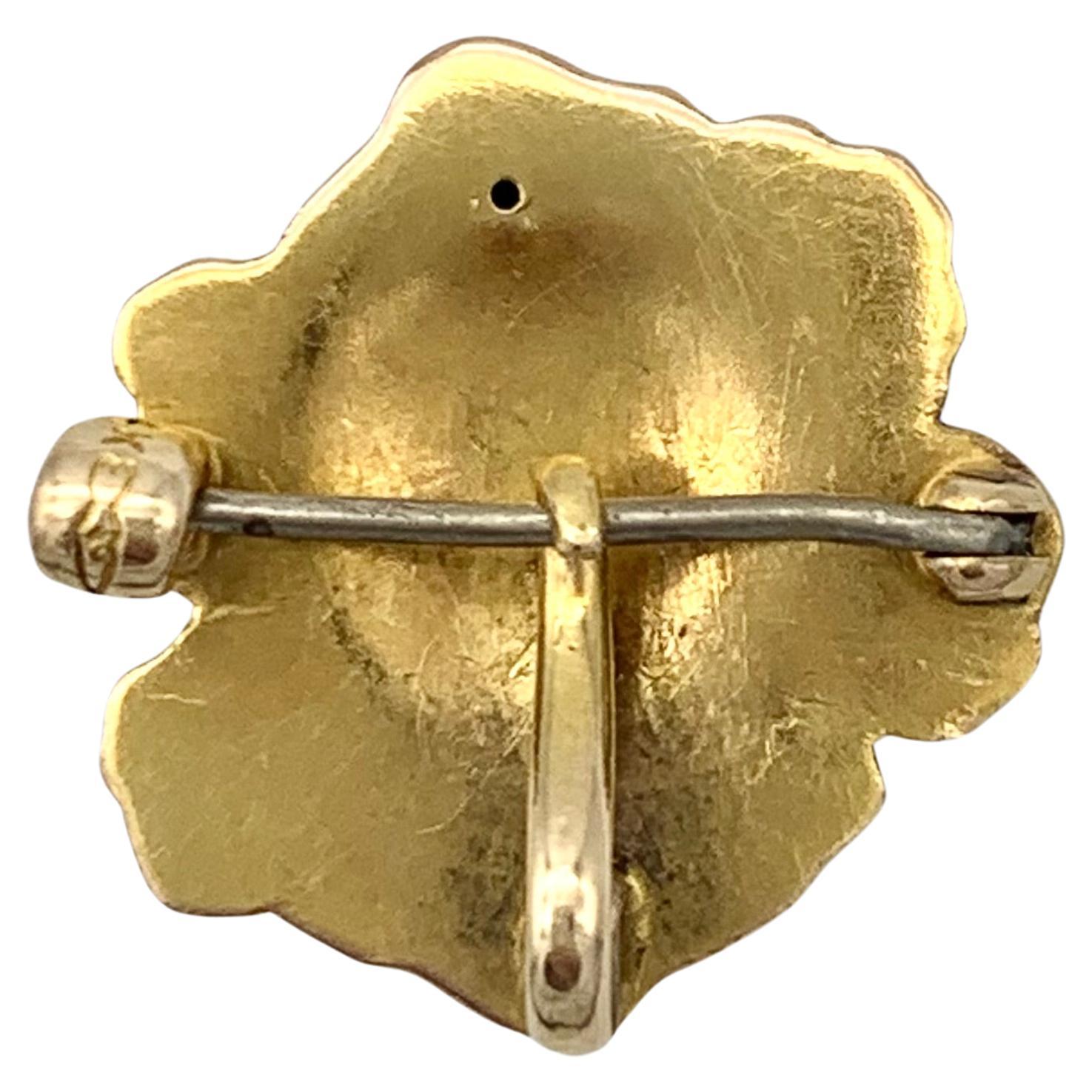 This lovely little Art Nouveau Brooch features the beautifully modelled face of of a young woman wearing a thin veil.  Her hair is decorated with thee large poppies set with natural oriental pearls, a poppy flower bud and leaf. The brooch is fitted