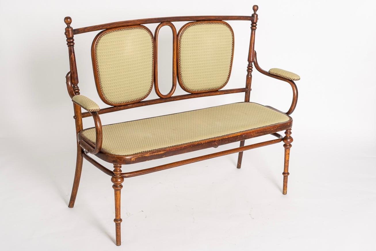 This exceptional antique Art Nouveau Vienna Secessionist Salon Suite includes a settee sofa bench and matching side chairs designed by Thonet and produced by Austro-Hungarian company Ungvar Ungarn circa 1900. The Ungvarer Mobelfabriks furniture