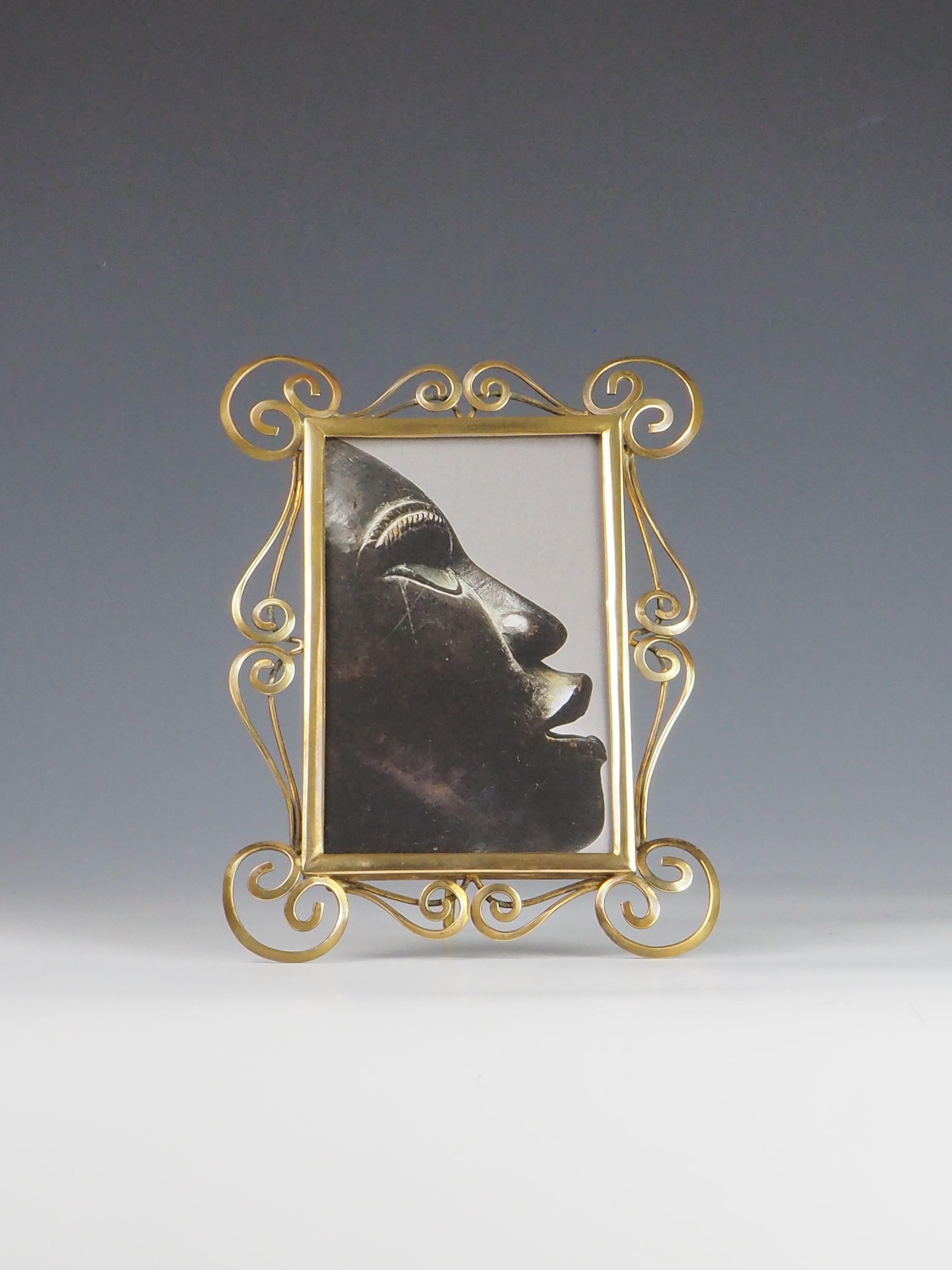Antique Art Nouveau Brass Photo Frame 

Step into the elegance of the early 20th century with this stunning Antique Art Nouveau Brass Photo Frame. Showcasing the quintessential artistry of the Art Nouveau period (circa 1890–1910), this frame