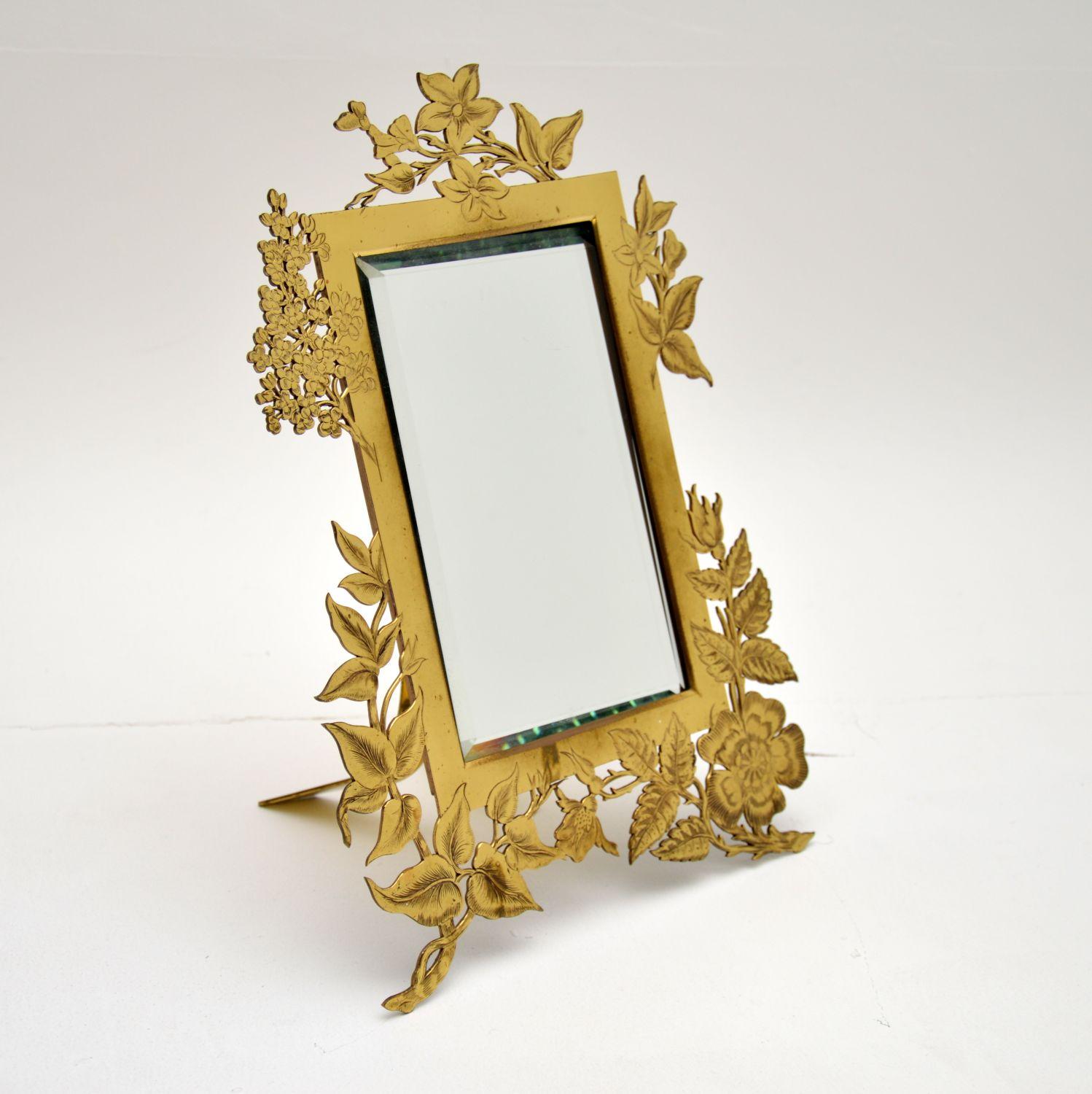 antique mirror with picture on top