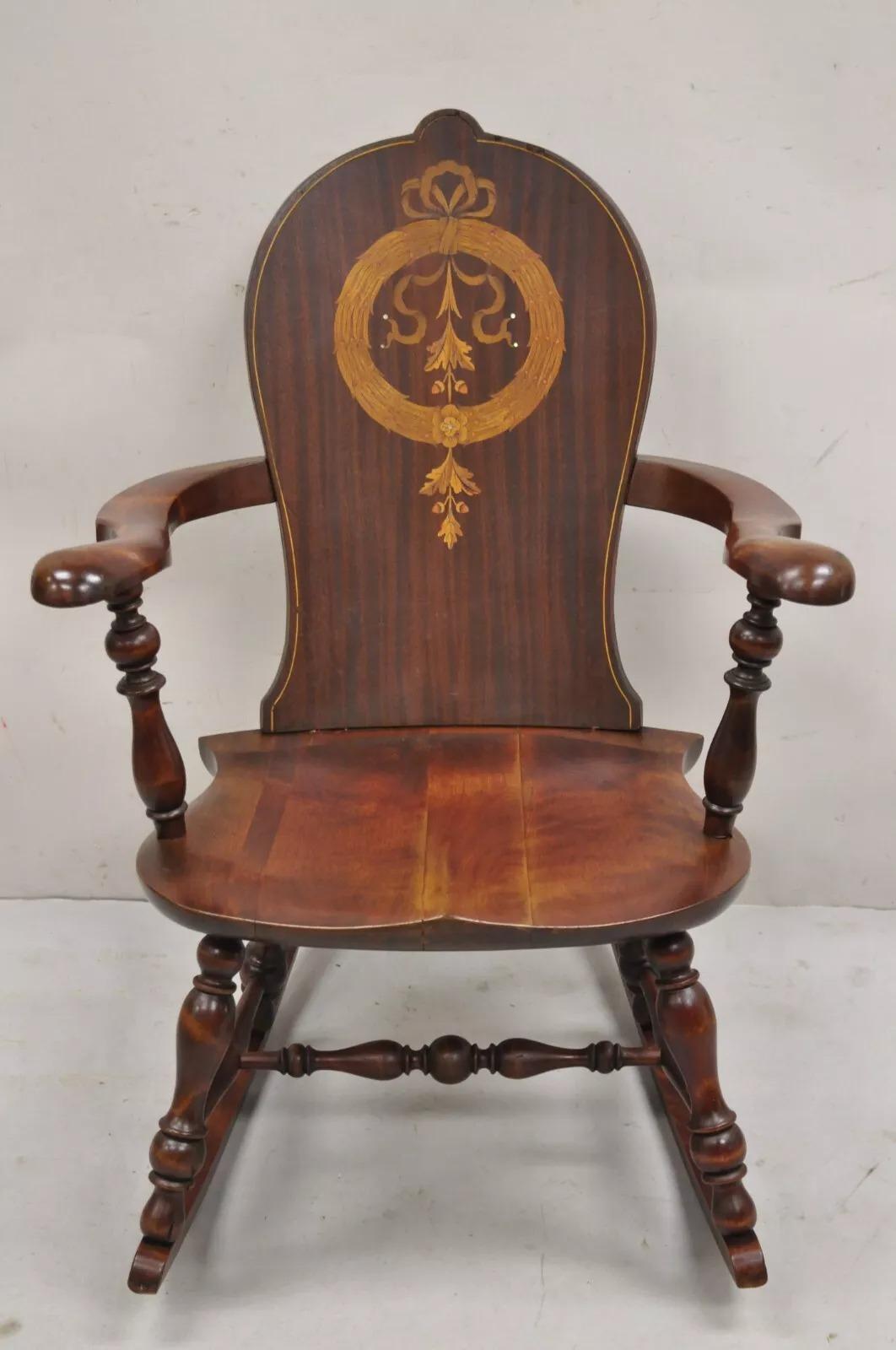Antique Art Nouveau Cherry Wood Rocking Chair Rocker With Wreath Marquetry Inlay. Circa Early 20th Century. Measurements: 36
