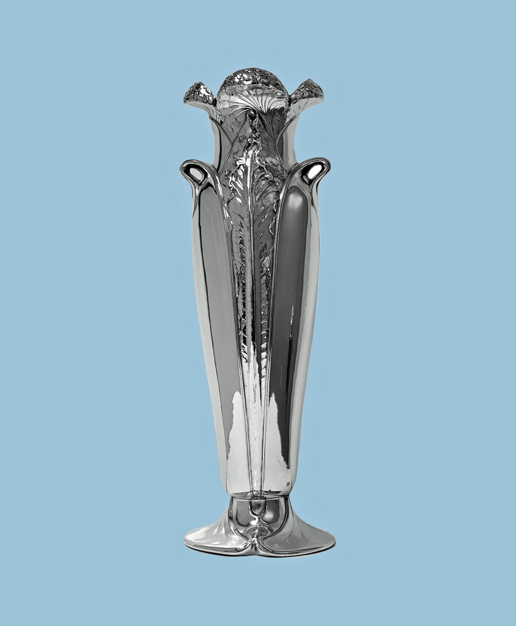 Antique Art Nouveau Christofle silver plate vase, France C.1900. The vase on oval swirl base rising to tapered bulbous form, elaborately decorated with raised tendril foliage design, the handles conforming, the top of open bud petal design. Overall