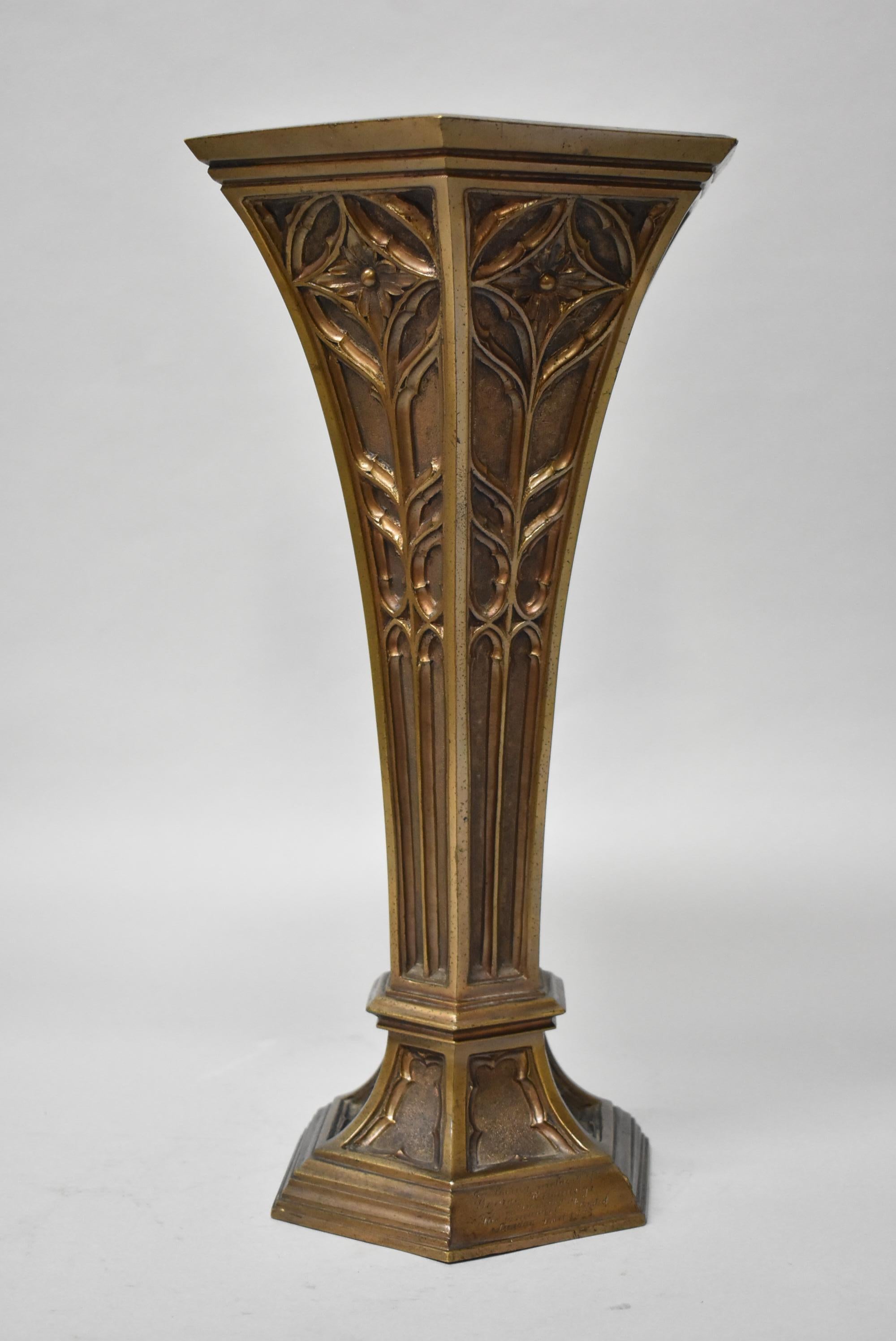 J. R. Lamb New York ecclesiastical art workers specializes in stained glass and bronze works. They created this hexagon vase with floral details, circa 1920s. Very nice condition, great patina. Dimensions: 15