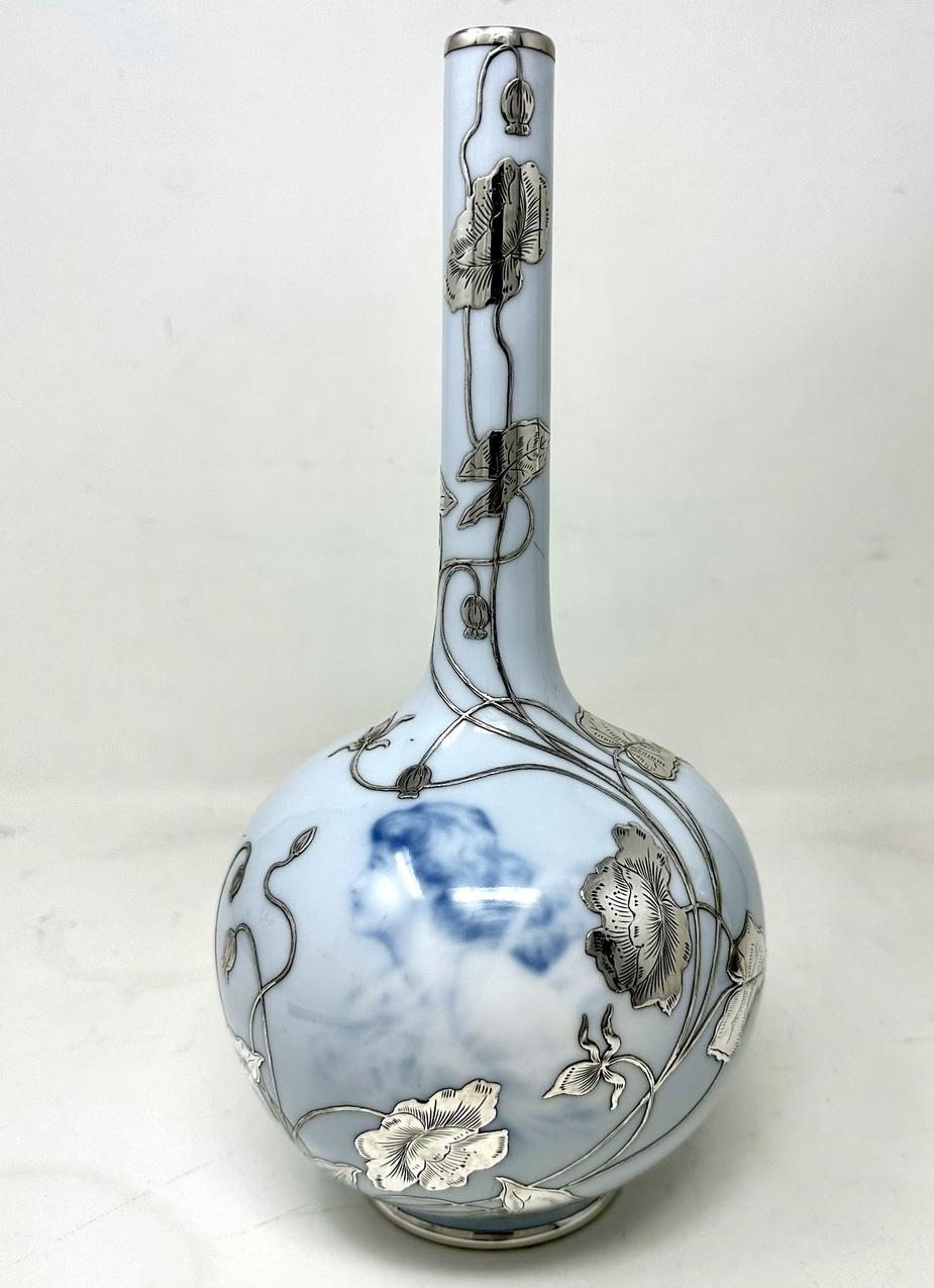 A Stylish Single Sterling Silver overlaid on Porcelain Continental Danish Royal Copenhagen Bottle Vase of generous proportions, early Twentieth Century 

The bulbous body form with tall slender neck, superbly overlaid with silver decorative flowers