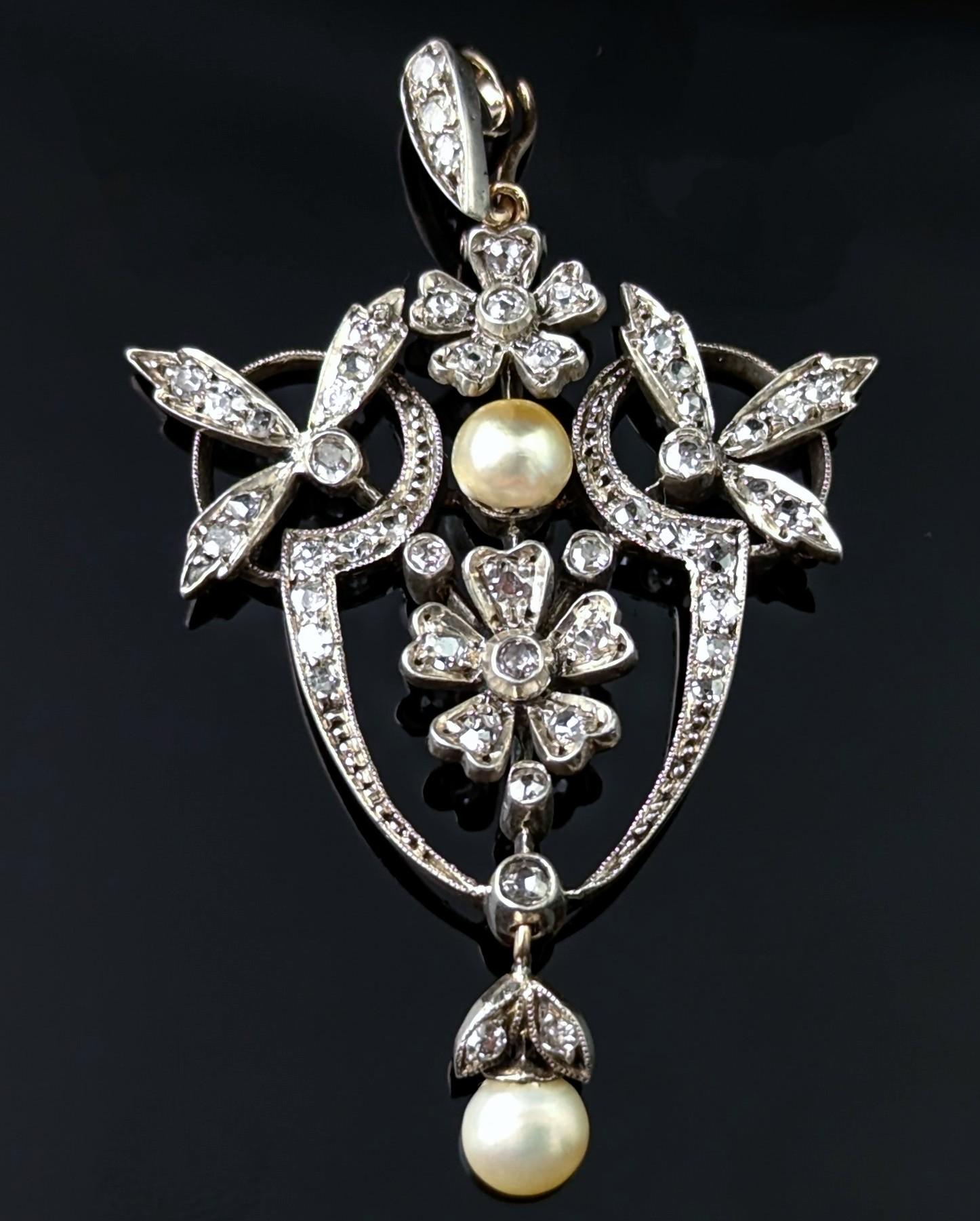 This stunning Art Nouveau diamond pendant is a true beauty!

This finely crafted piece is both elegant and bold at the same time, the pendant has a beautiful openwork design giving it a lovely delicate vibe and is set with over 1ct of old cut and