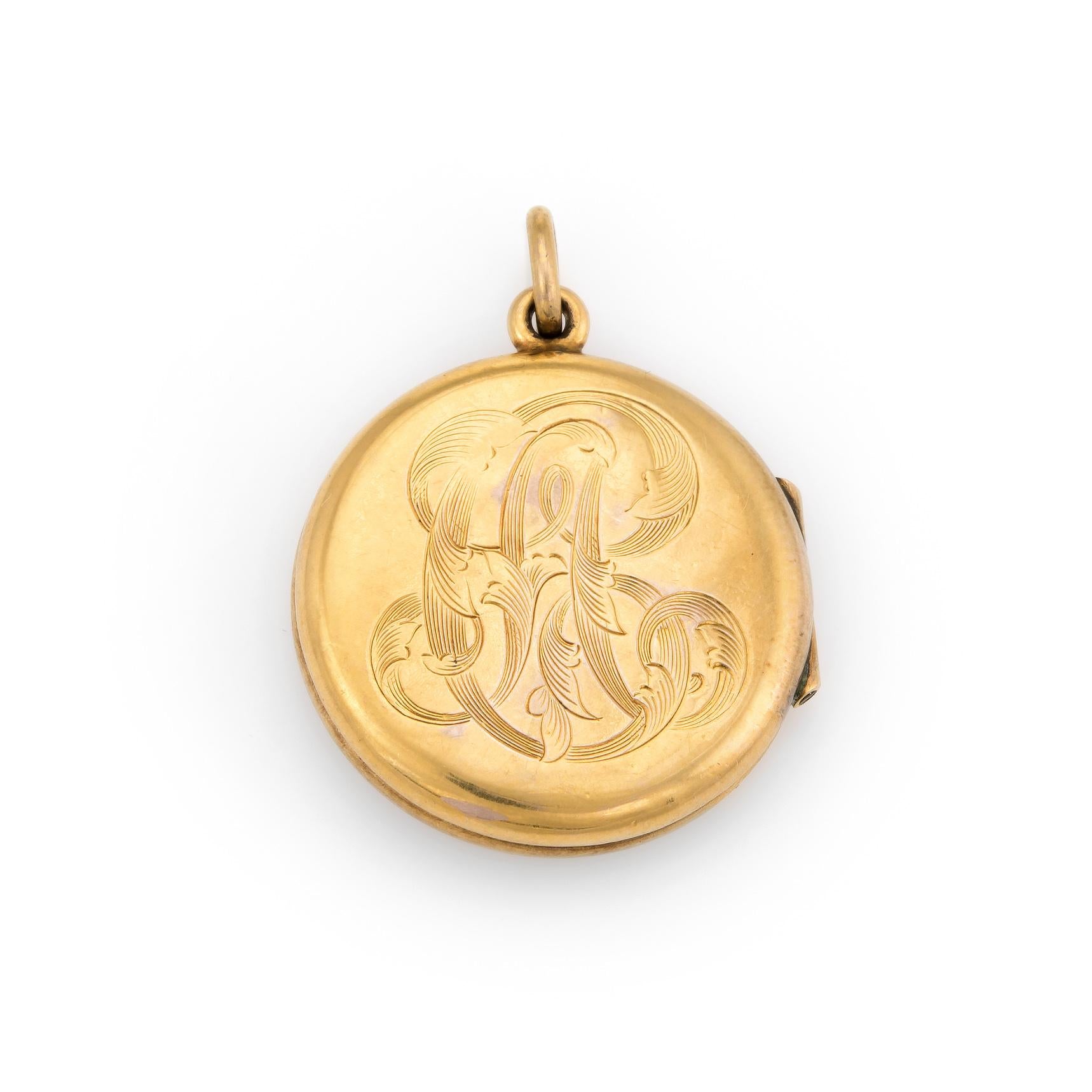 Finely detailed Art Nouveau era locket (circa 1900s to 1910s), crafted in 10 karat yellow gold. 

Old mine cut diamond is estimated at 0.10 carats (estimated at H-I color and VS2-SI1 clarity).

The back of the locket is engraved with the initials