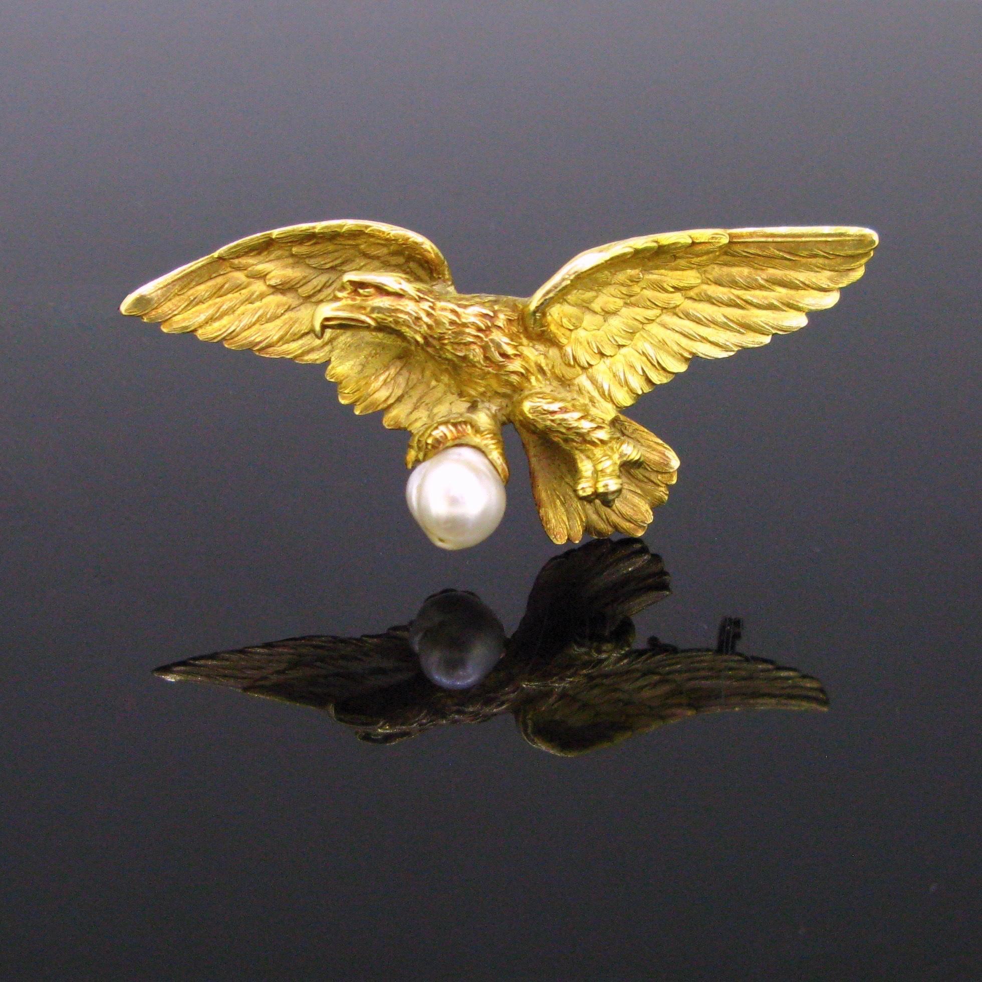Weight:	18.73gr


Metal:		18kt Yellow Gold


Stones:	1 Pearl 	
•	Dimensions: 	7.51 x 7.69mm 


Condition:	Very Good


Hallmarks:	French – Eagle’s head
		

Comments: 	This stunning pendant/brooch comes directly from the Art nouveau era.  The