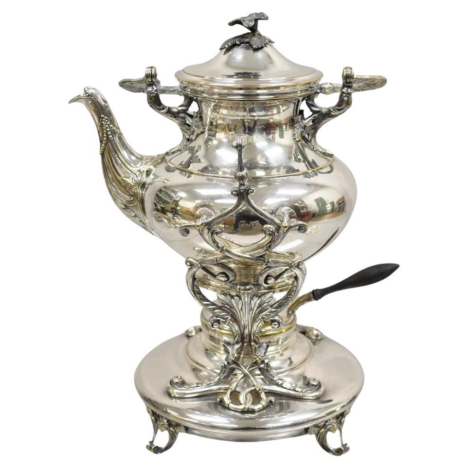 Antigua tetera Art Nouveau inglesa plateada basculante con soporte
