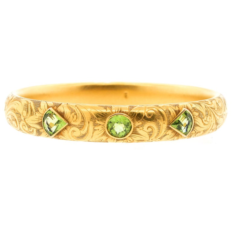 Antique Art Nouveau Engraved 14 Karat Gold Peridot Hollow Form Bangle Bracelet For Sale at 1stdibs