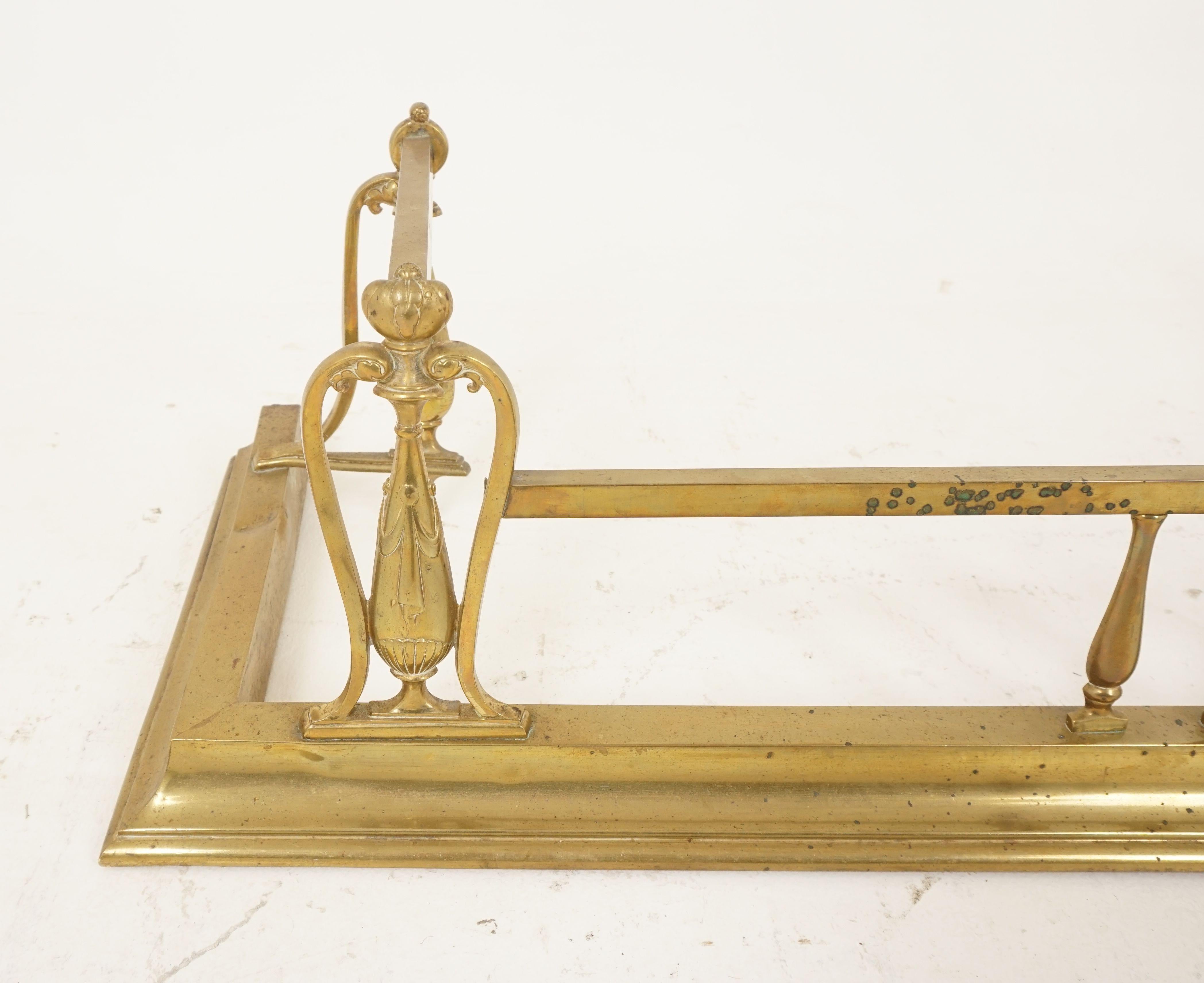 Antique Art Nouveau brass fireplace fender, surround, hearth guard, Scotland 1900, H115

Scotland, 1900
Brass
Wonderful brass embellishment
Upper rail with moulded edge below
Scrolled poker rests on the ends
Signs of use and wear
Note: Dent on the