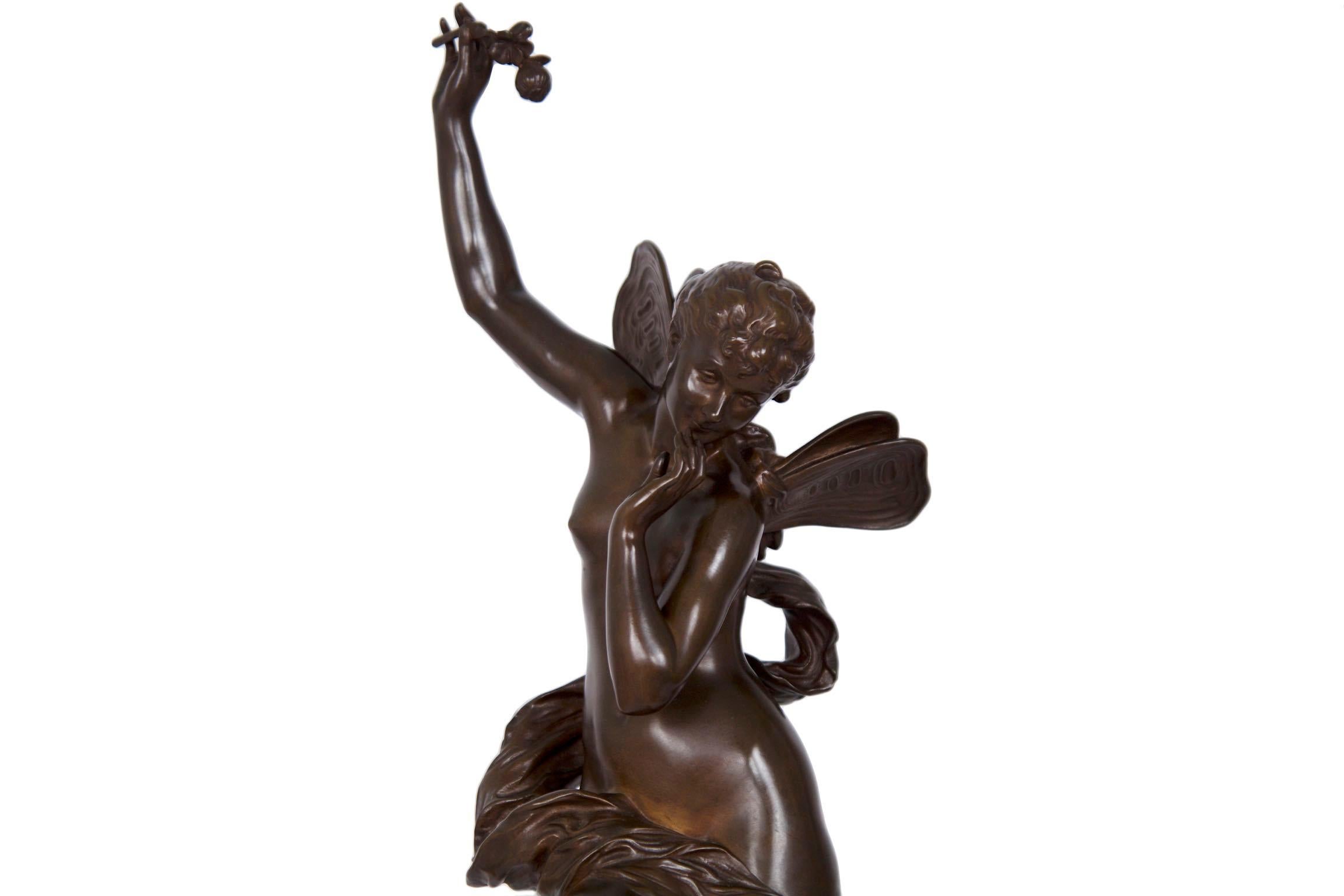 A large and moving work by Lucien Pallez from the first quarter of the 20th century, this fine bronze sculpture captures a nymph rising on the clouds over swirls of florals as she looks down from the heavens on the earth below. The work was