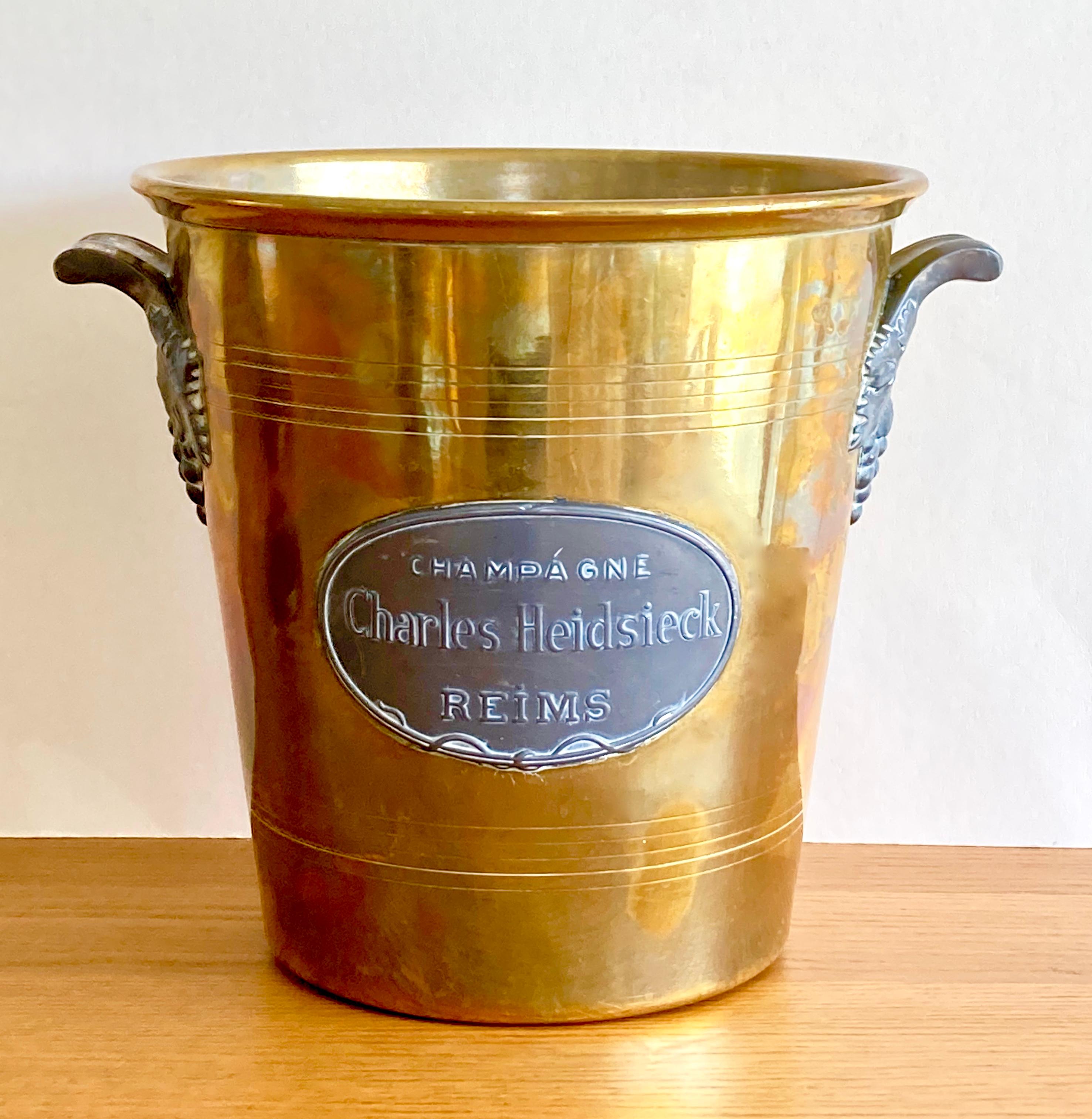A magnificent, authentic, art nouveau champagne bucket from the famous French champagne maker Charles Heidsieck in Reims, founded in 1851. This rare model dates from the early 1900s. It is made in France for Charles Heidsieck by Argit SFOA (Société