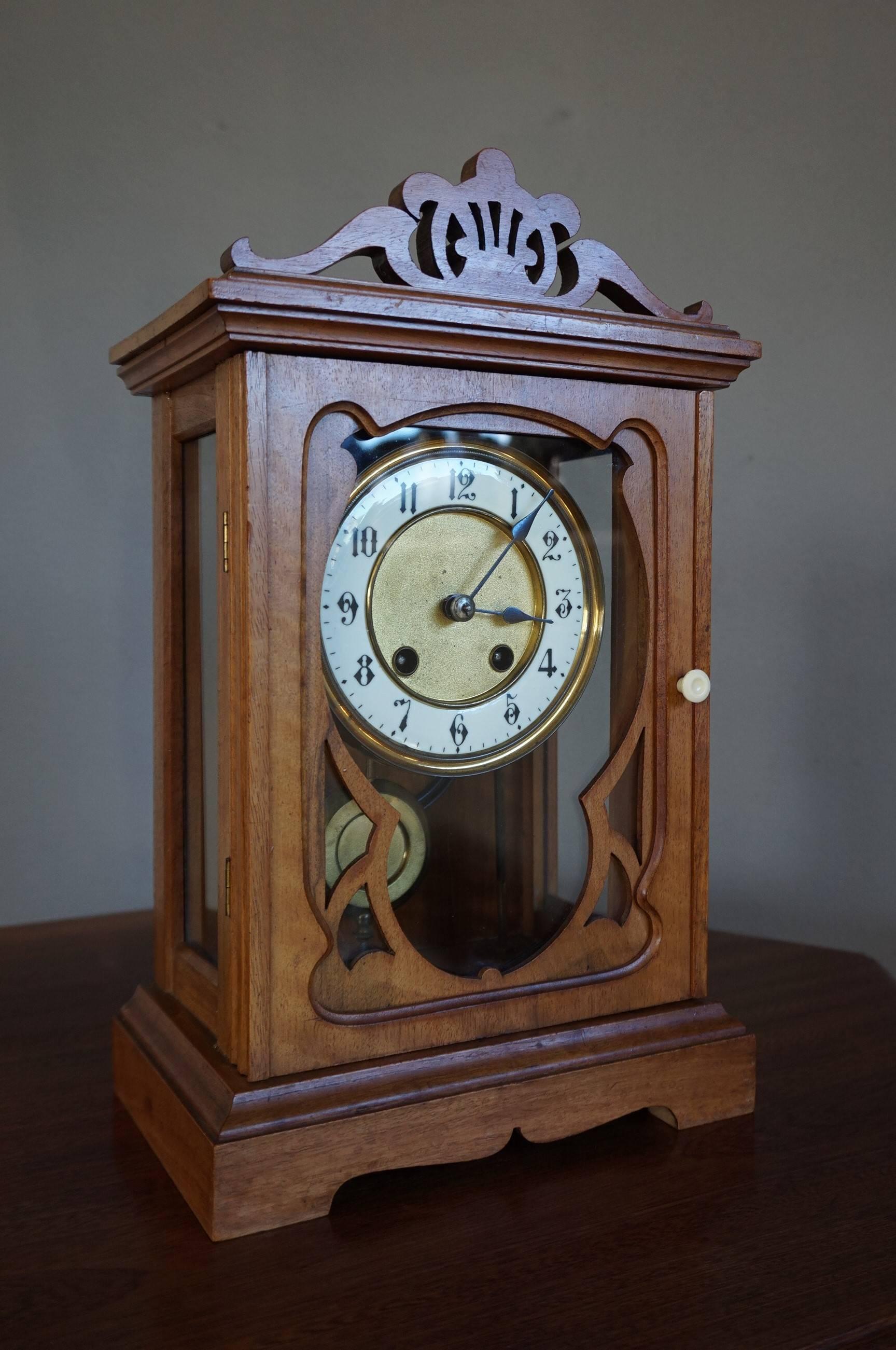 Practical size and beautiful shape Arts and Crafts mantel clock.

Because of the stylish design and the warm and natural patina of the fruitwood, this handcrafted clock from the early 1900's is a real beauty. The depth in the layers of wood that are
