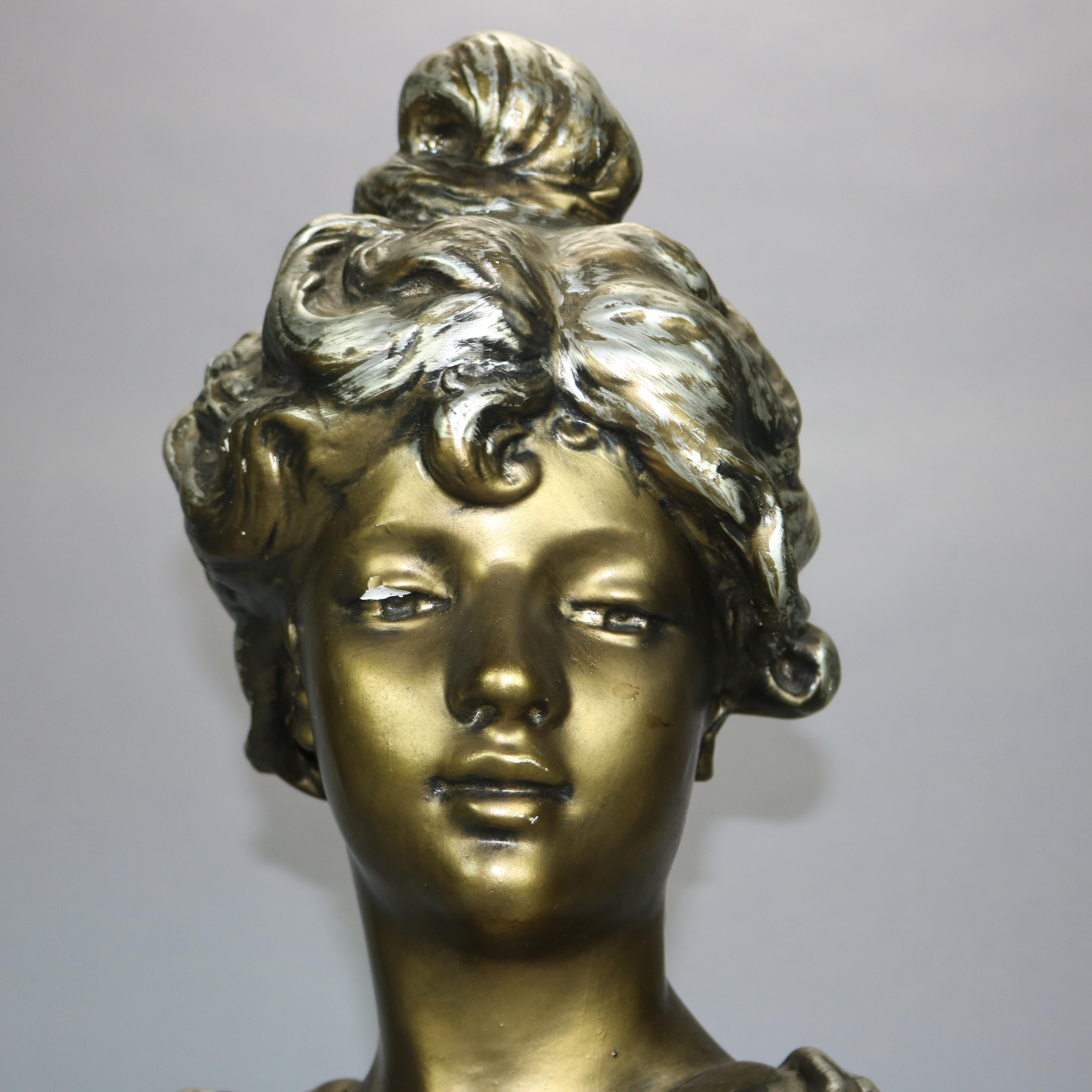 An antique Art Nouveau sculpture offers gilt plaster depicting portrait bust of a woman on plinth, unsigned, c1910

Measures: 23.5