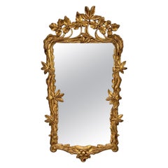 Miroir mural ancien de style Art nouveau en bois doré, avec un cadre orné de feuilles botaniques sculptées à la main