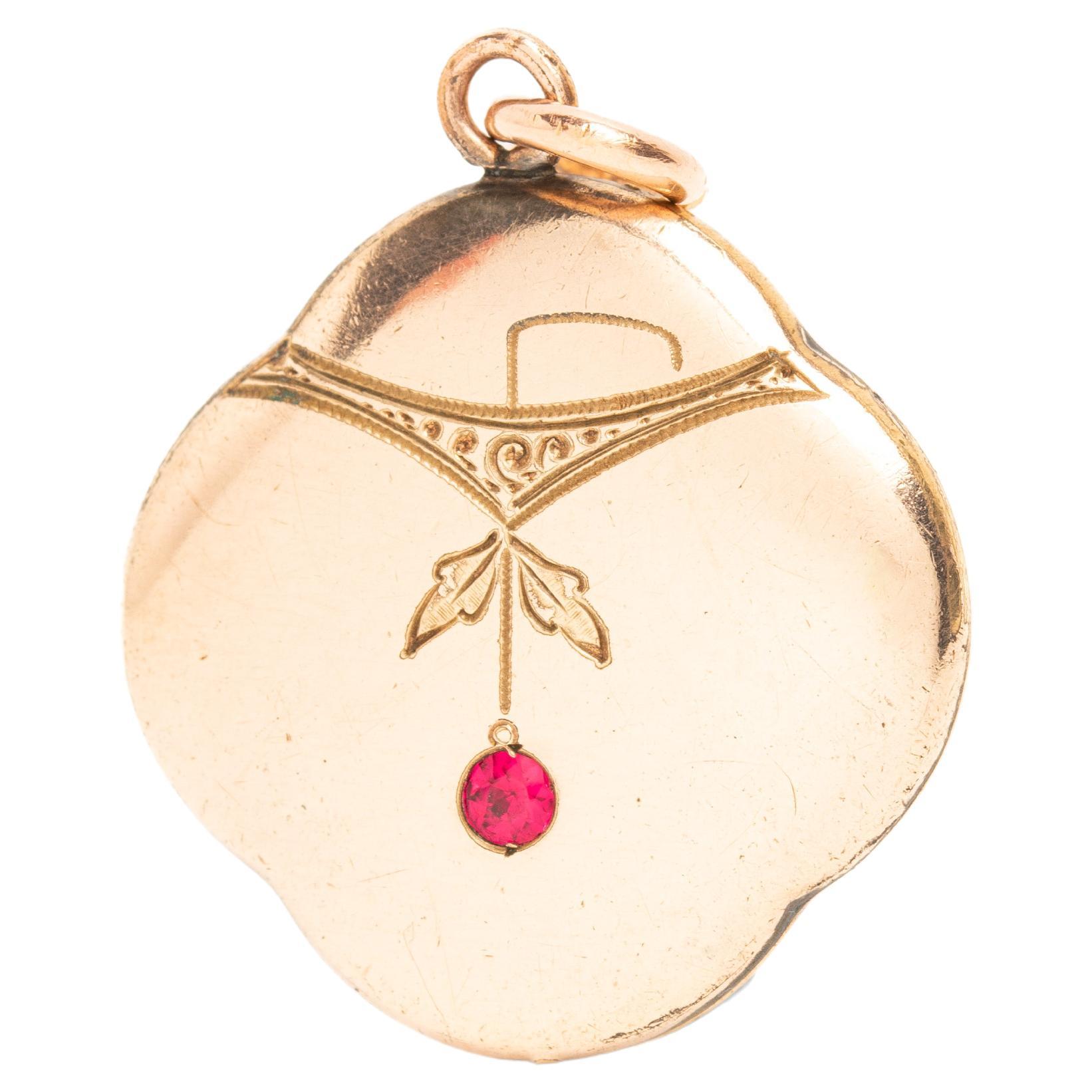 Art Nouveau Gold Plated Engraved Pendant With A Ruby For Sale