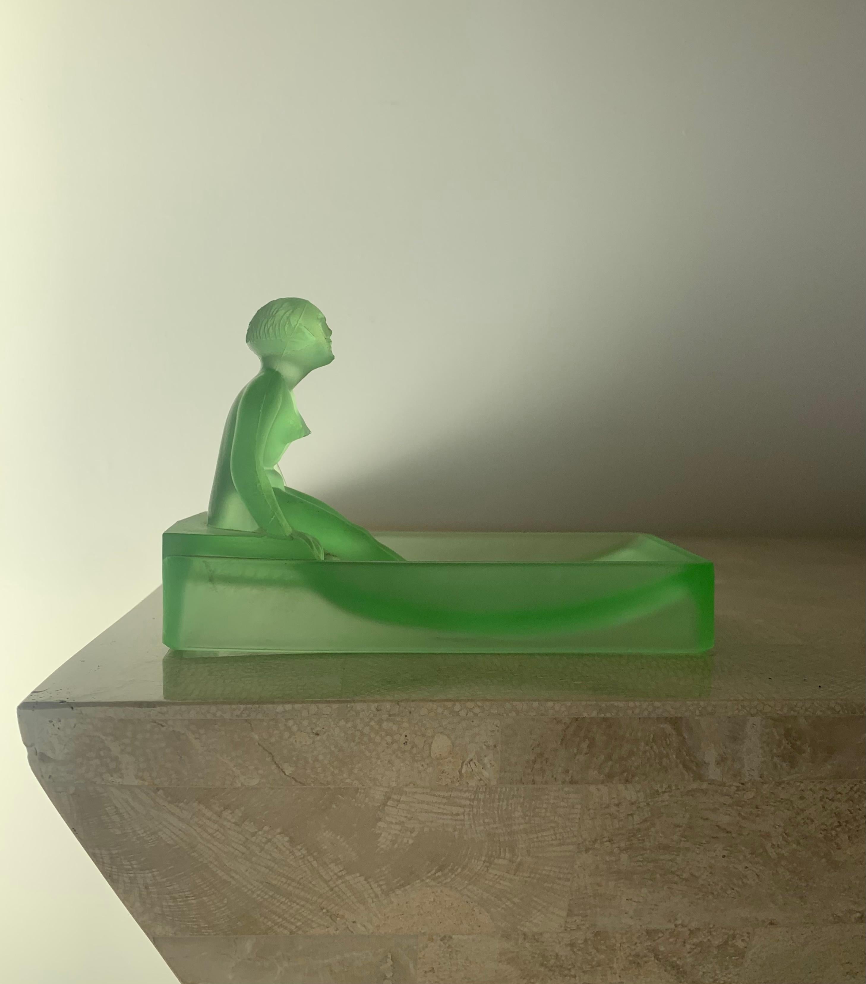 An extraordinarily rare relic of the 1920s Art Deco period, designed by Heinrich Hoffman and refashioned by Sarsaparilla Deco Designs (aka SDD) in 1981: a depression glass vide-poche in frosted key-lime green featuring a nude bather perched at the
