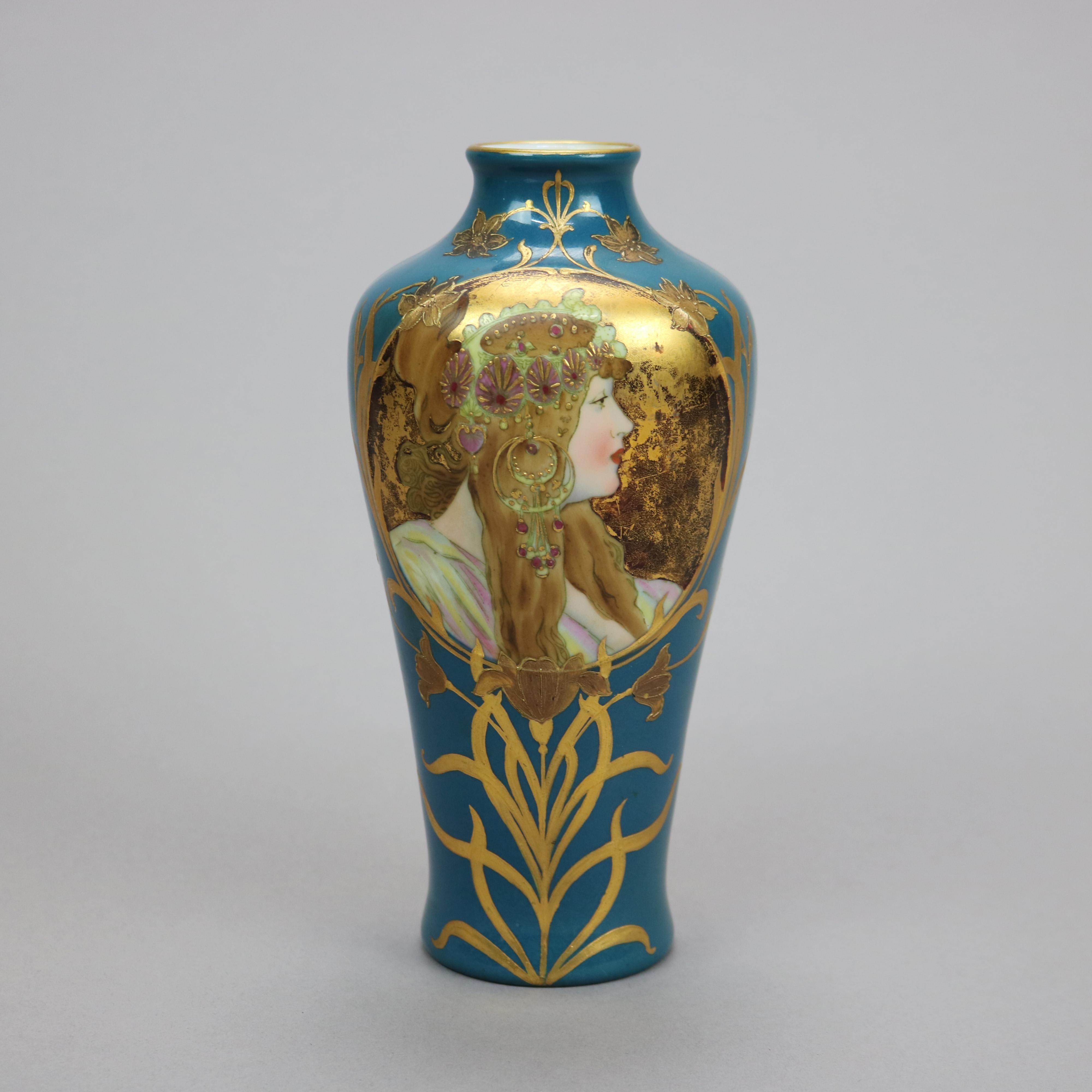 An antique German Art Nouveau vase by Gebruder Heubach offers porcelain construction with reserve having portrait of a woman on turquoise blue ground, gilt scroll highlights throughout, maker mark on base as photographed, c1900

Measures - 8.25''