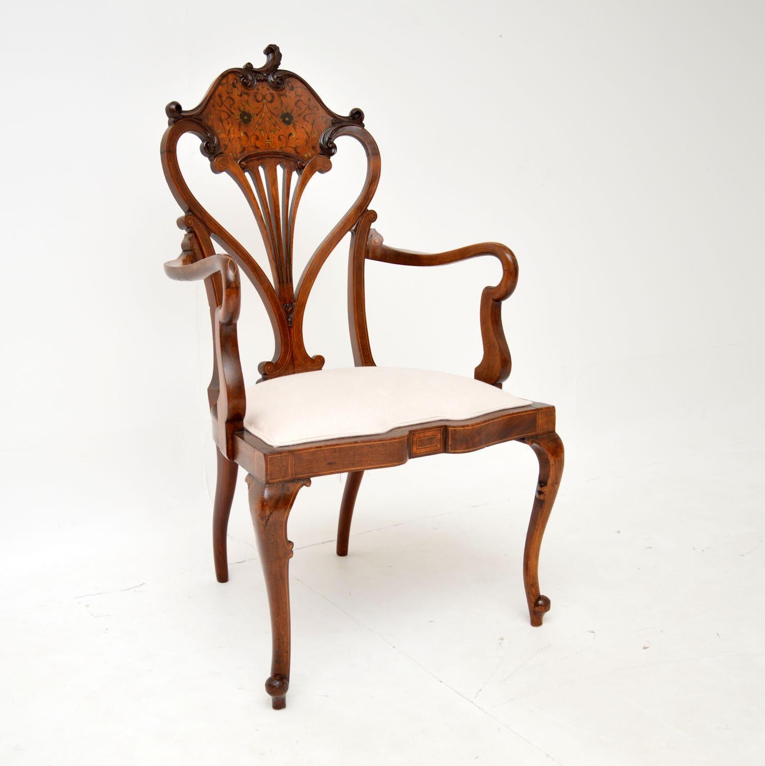An absolutely stunning antique Art Nouveau armchair. This was made in England, it dates from around the 1890-1900 period.

It is beautifully made and is of great quality. The tulip shaped back is pierced, with fine carving, intricate inlaid