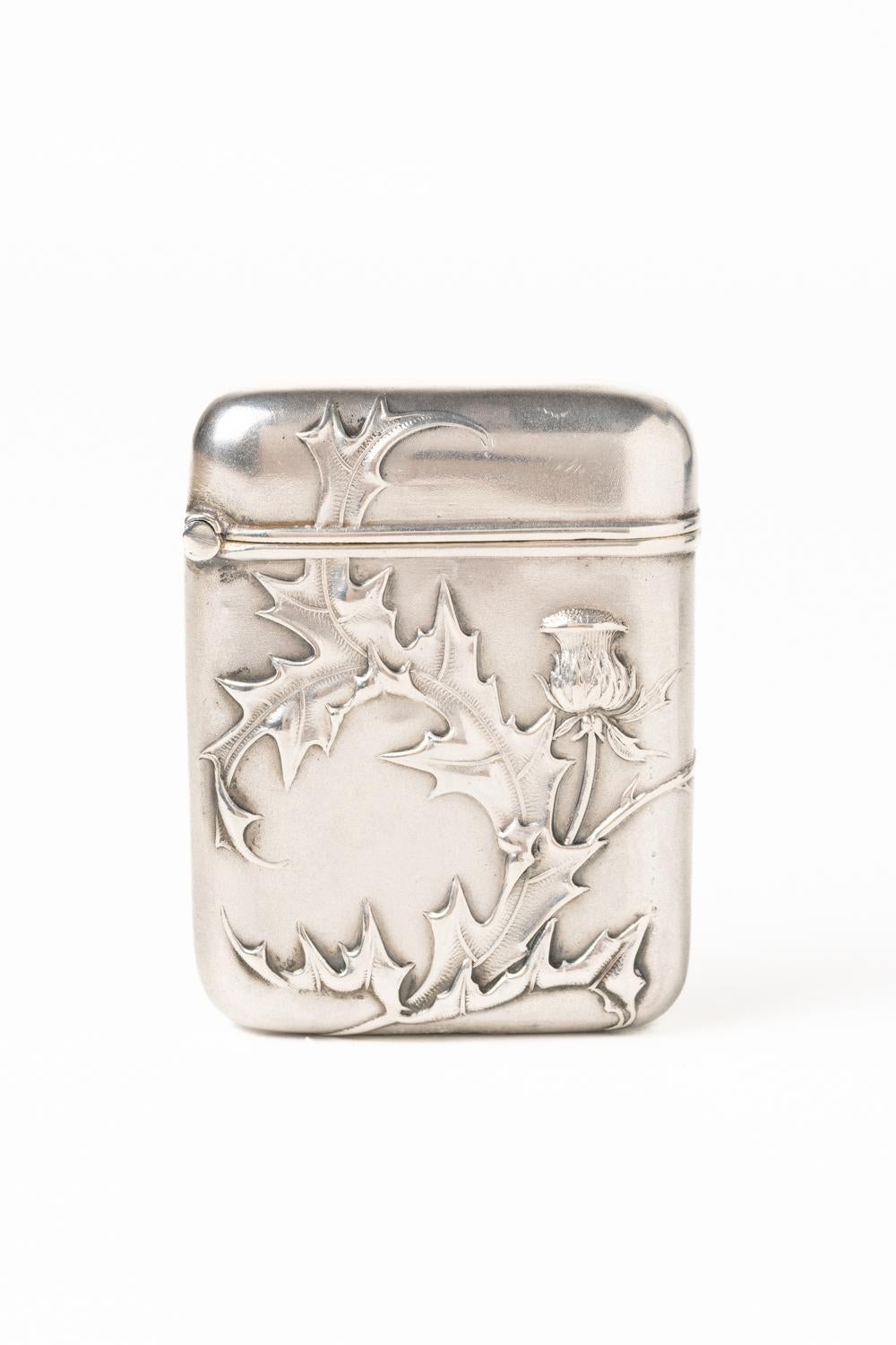 Antique Art Nouveau/Jugendstil German Rare Sterling Silver Vesta Case decorated with a thistle. The piece is embossed throughout with thistle flower and leaves; it has round corners and a gilt-wash interior. The thistle is a symbol of protection,