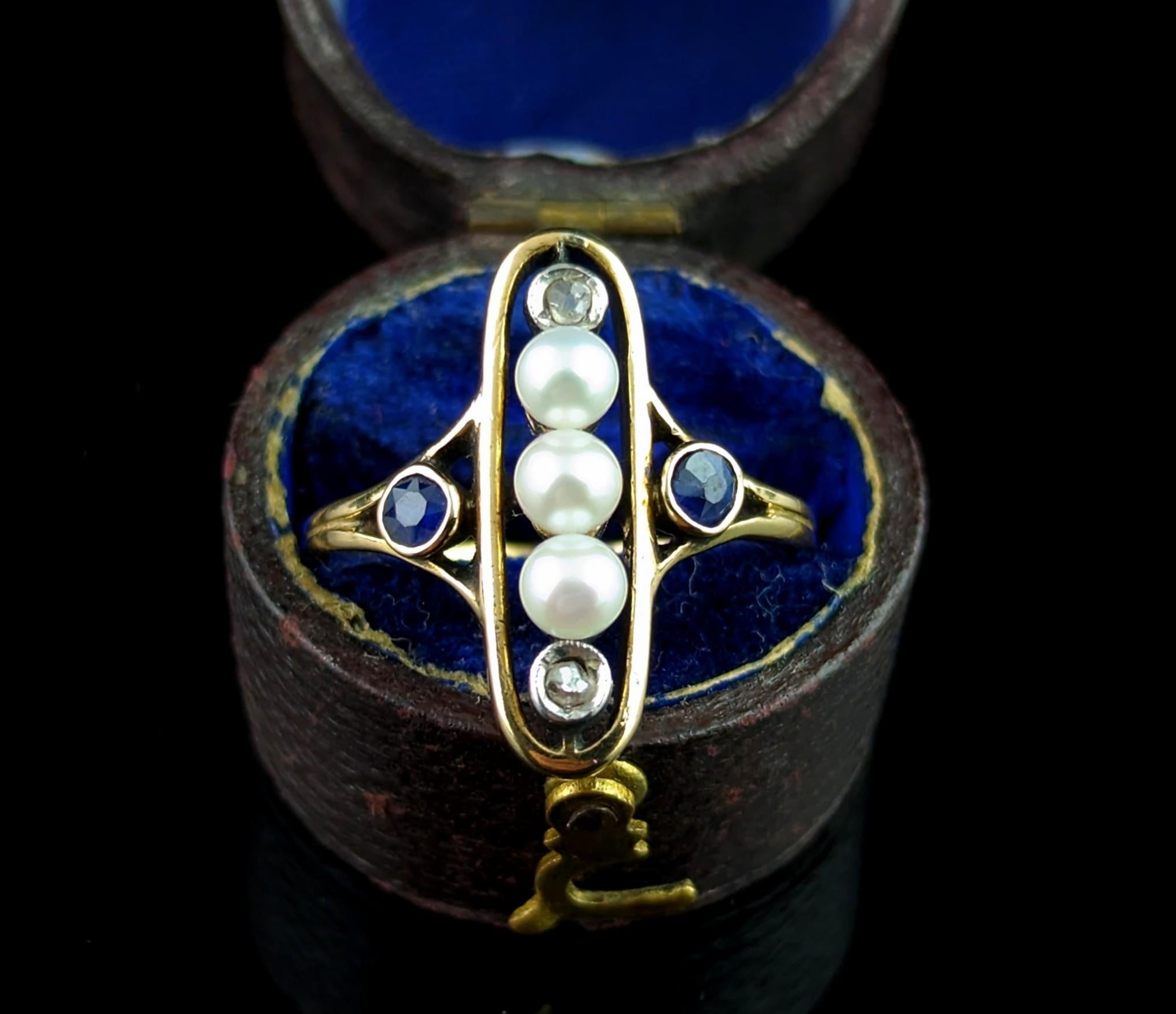 A truly stunning Art Nouveau era Sapphire, diamond and Pearl lozenge ring, this beauty has everything going for it and is an absolute dream.

Crafted in rich 18ct yellow gold it has a smooth gold lozenge frame set to the centre with two rose cut