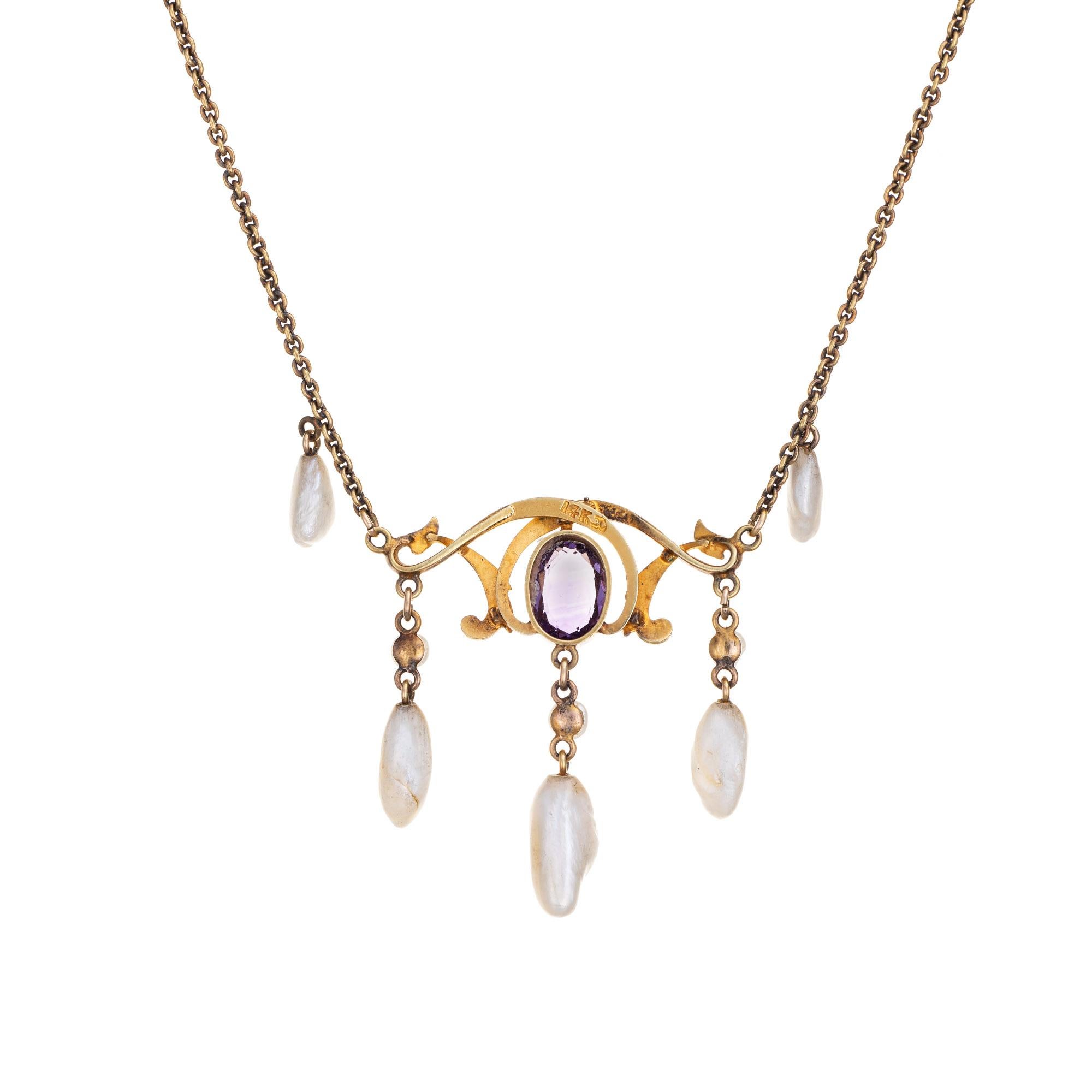Stylish and finely detailed Art Nouveau drop necklace (circa 1900s to 1910s) crafted in 14 karat yellow gold. 

One estimated .75 carat amethyst, 6mm x 3.5mm to 9mm x 3mm sawtooth pearls and enamel are set into the necklace. The amethyst is in very