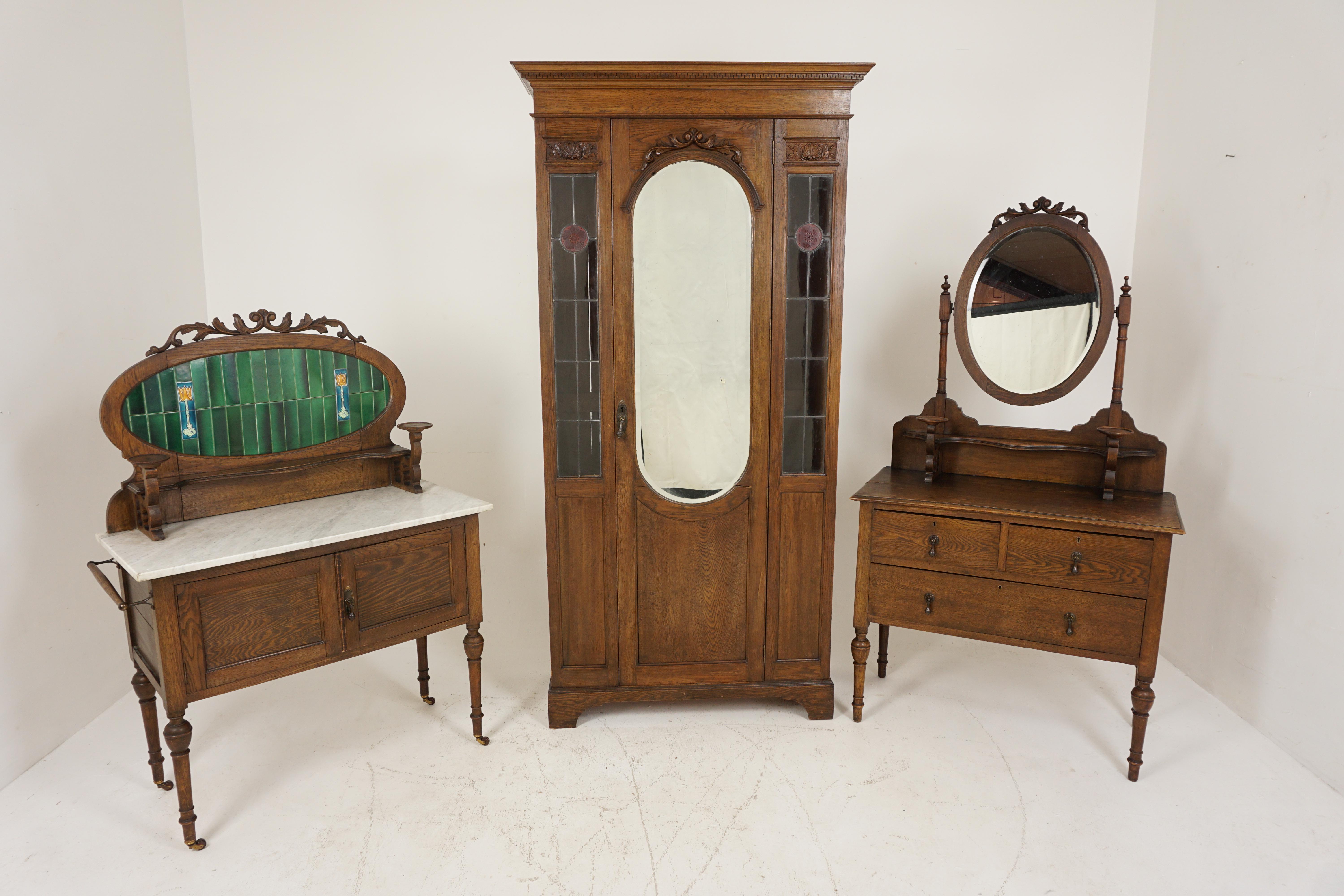 Antique Art Nouveau oak 3 piece bedroom suite, Scotland 1910, B2628

Scotland 1910

Solid oak
Original finish

Armoire with moulded cornice
Centre beveled mirror door flanked by pair of leaded glass panels 
With interior hanging