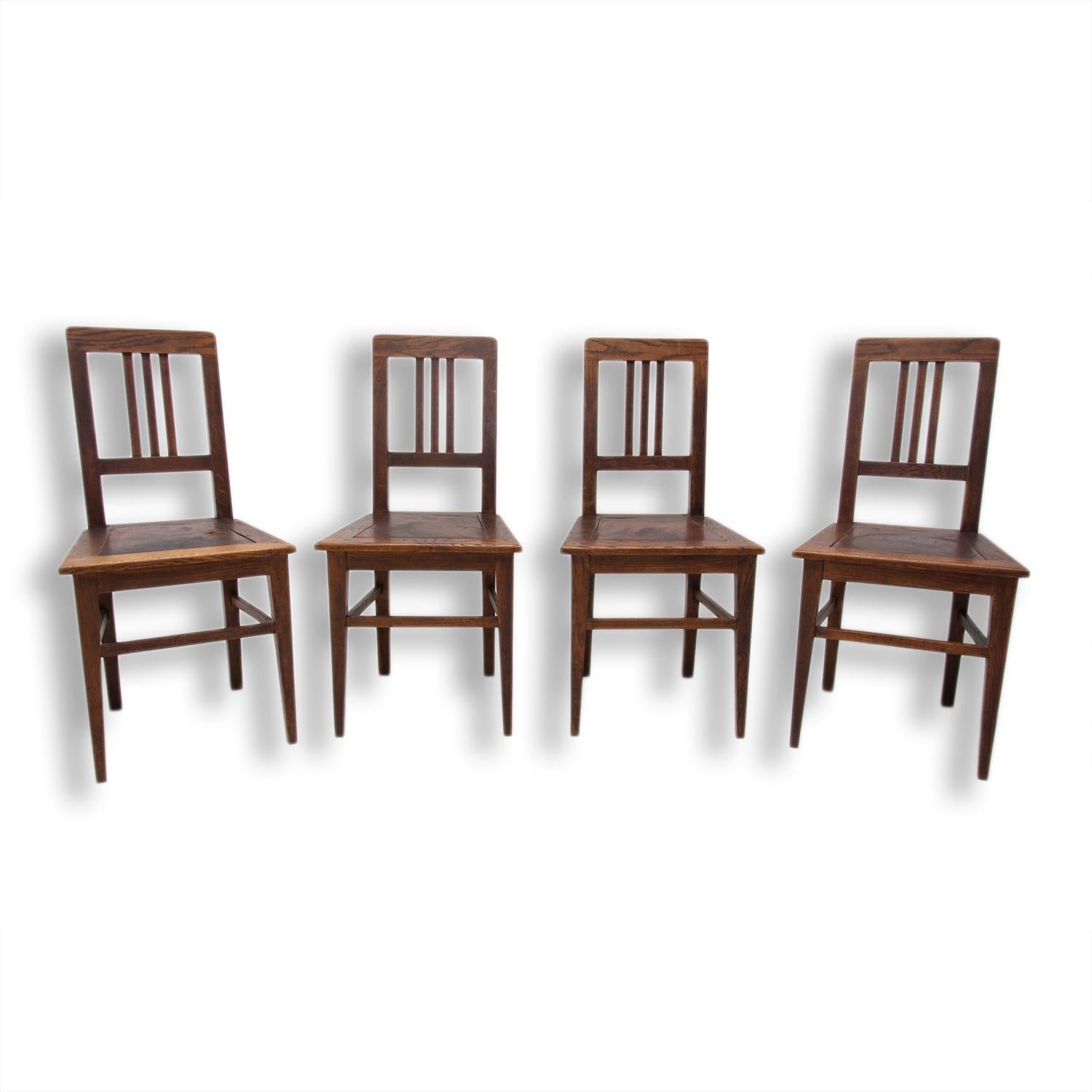 These Art Nouveau dining chairs were made in Austria-Hungary, circa 1910. They are made of dark stained oakwood. They have original leather upholstery. The chairs are in very good condition. Price is for the set of four.

 