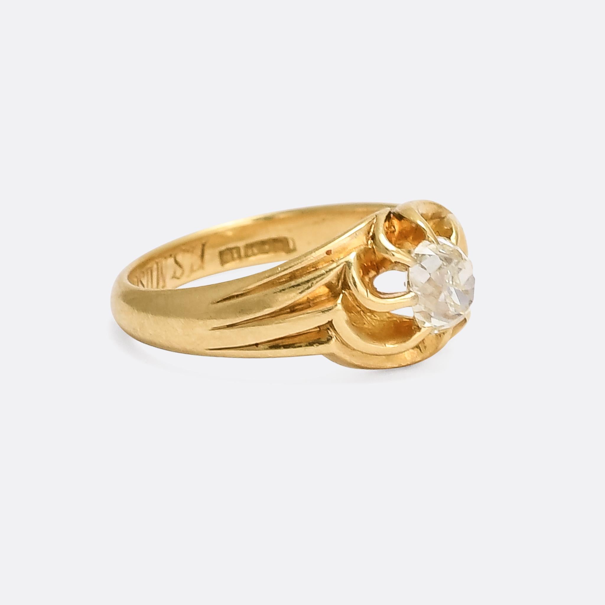 This ring is something of a hybrid in terms of style and period, artfully bridging the gap between Victorian and Art Nouveau. Stylistically it's a scalloped gypsy solitaire but with a literal twist: the claws are formed into a graceful swirl, met by