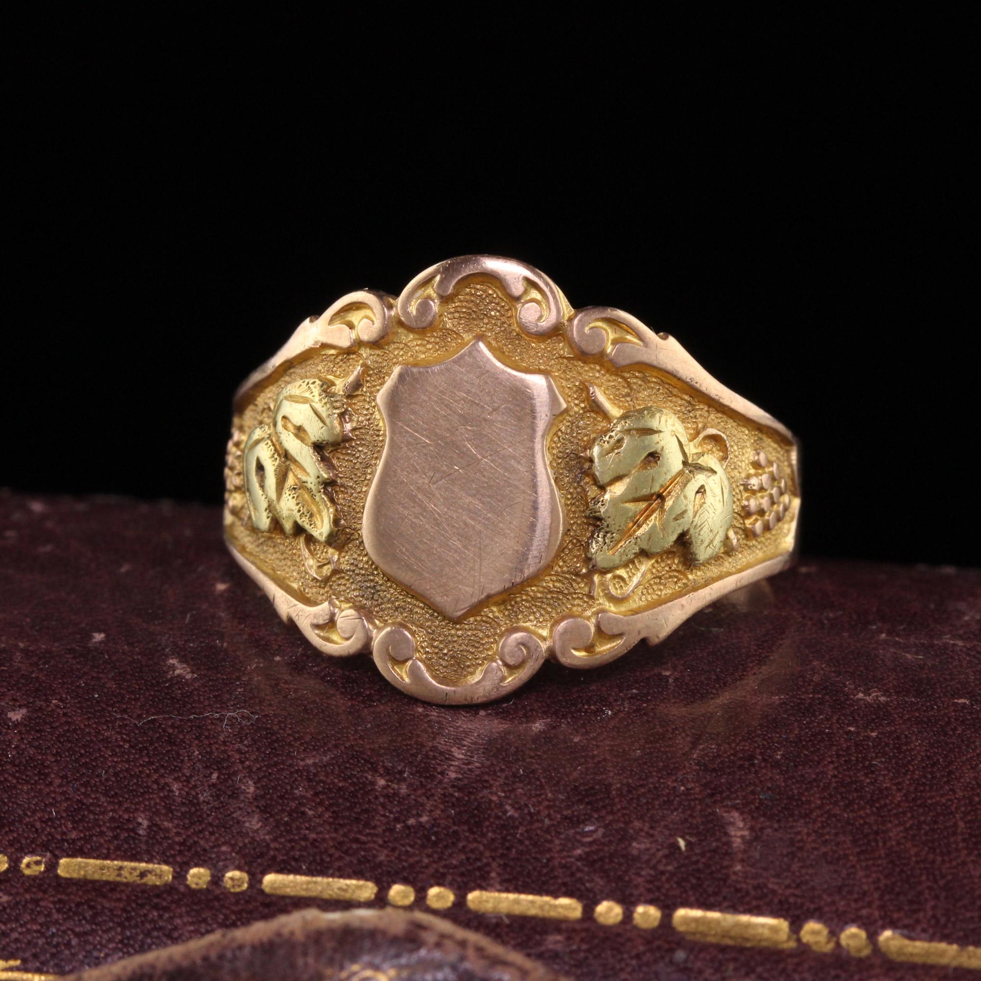 Beautiful Antique Art Nouveau Otsby Barton 10K Yellow Gold Tri Tone Signet Ring. This gorgeous signet ring is crafted in 10k yellow and rose gold. The ring has a shield on the top which has not been engraved before. It has a scene of grape leaves on