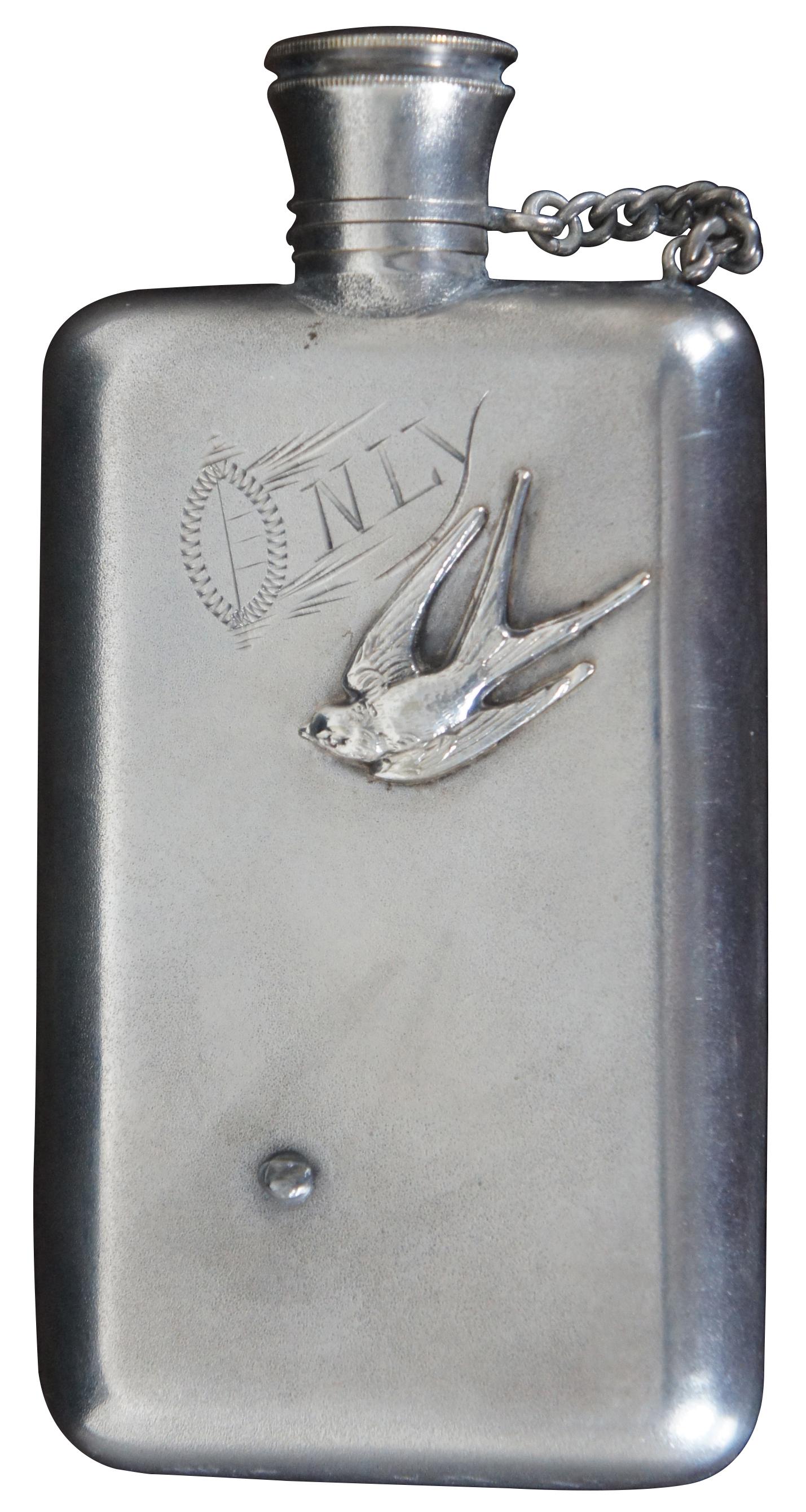 Antique repousse floral silver plate pocket flask with sparrow bird and engraved “Only” on the reverse.
 