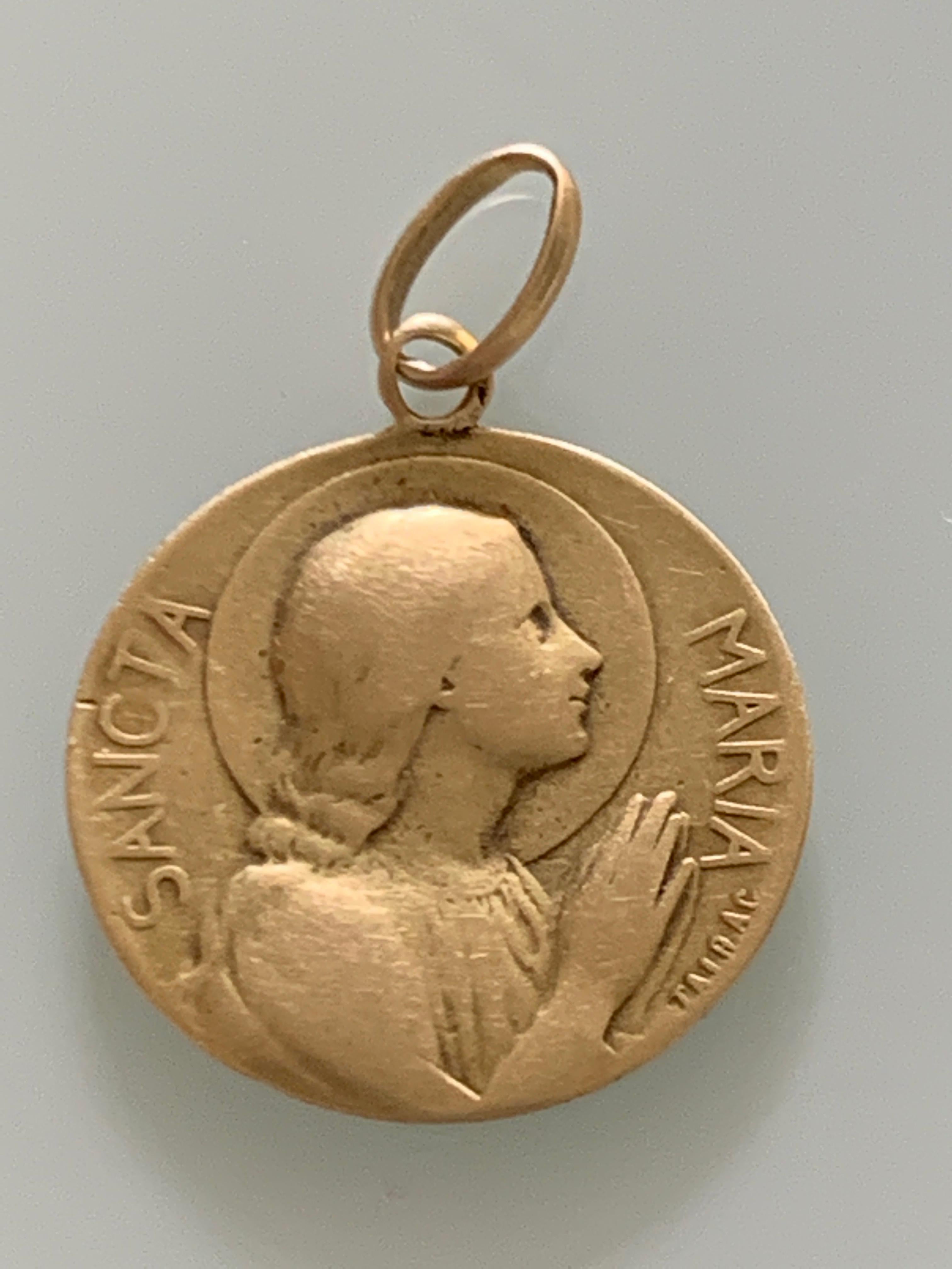 Antique 18ct 750 Gold 
Art nouveau french 
Sancta Maria Pendant 
(Virgin Mother of Jesus)
Circa 1890-1910

with Artists name applied Jaibac ?
Fully tested and found to be 18ct Gold
Weight 2.08 grams
Diameter 17.75 mm

unhallmarked.
Enscribed with