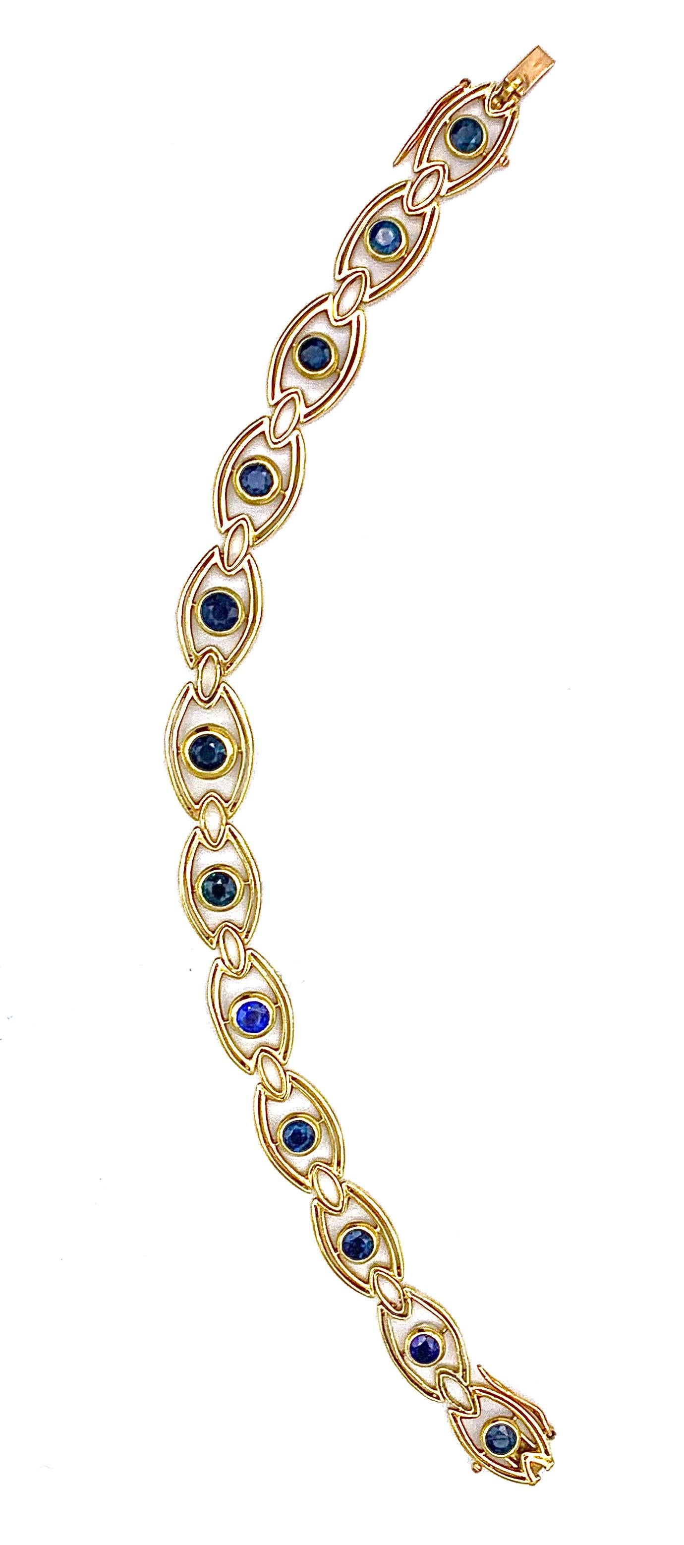 This elegant  Art Nouveau link bracelet is composed out of twelve eye shaped links set with round cut sapphire of ca 0.20 carat each.  The twelve elements are connected by eleven small hinged eye shaped elements.