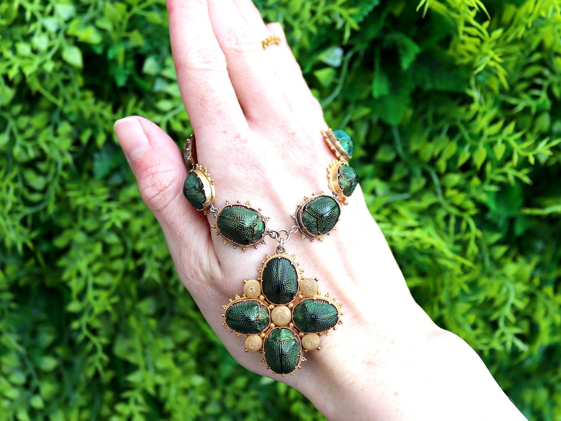 A stunning, fine and impressive, unusual antique preserved scarab beetle and 22 karat yellow gold necklace; part of our diverse collection of antique Victorian jewellery.

This exceptional and unusual antique Victorian necklace has been crafted in
