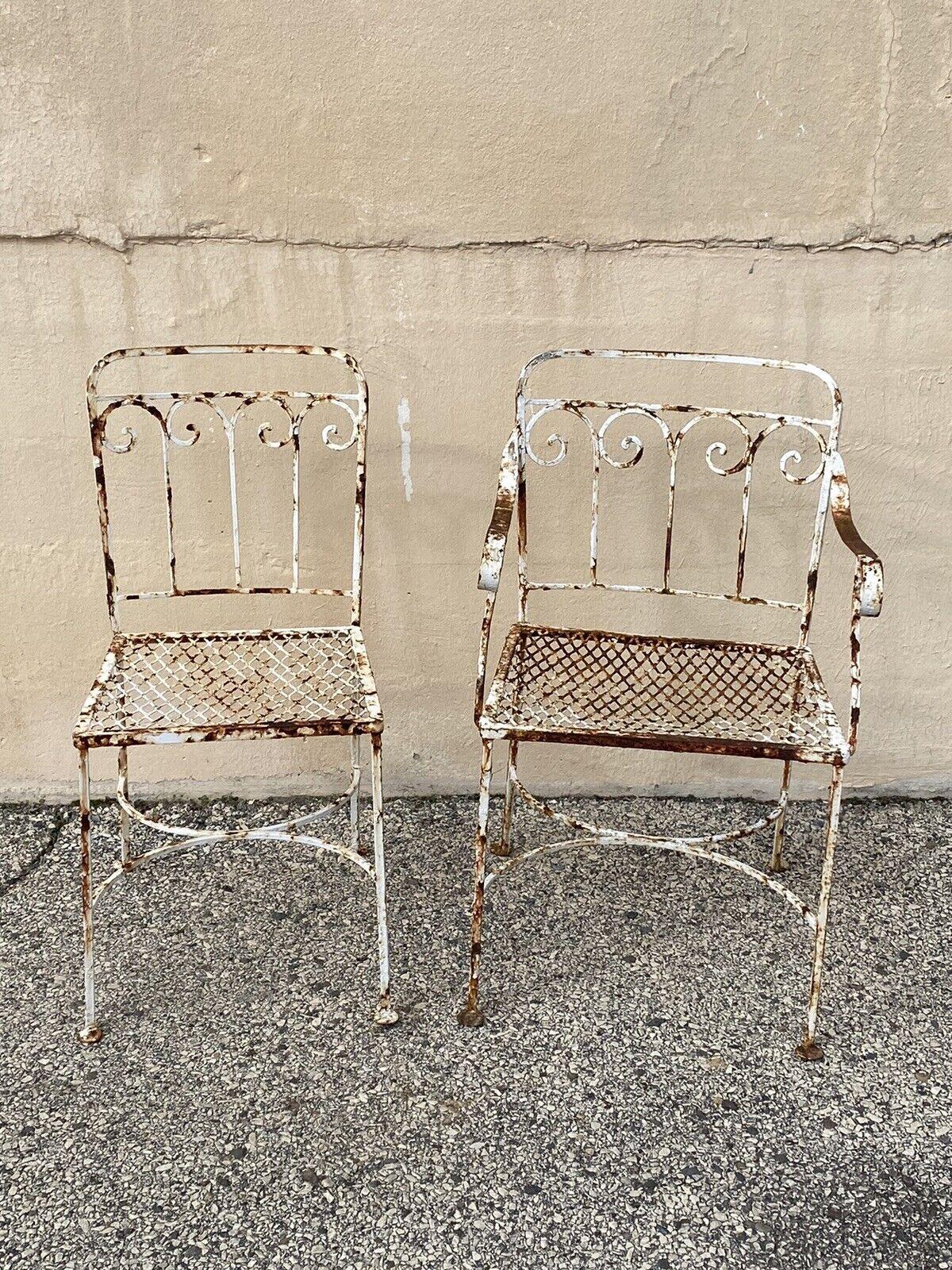 Antique Art Nouveau Scrolling Wrought Iron Garden Patio Dining Chairs - A Pair. Circa Early to Mid 20th Century.
Measurements: 
Armchair: 31